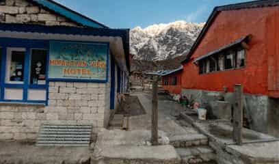 Himalayan View Hotel entrance in Bhimthang with snow-capped mountains in the background.