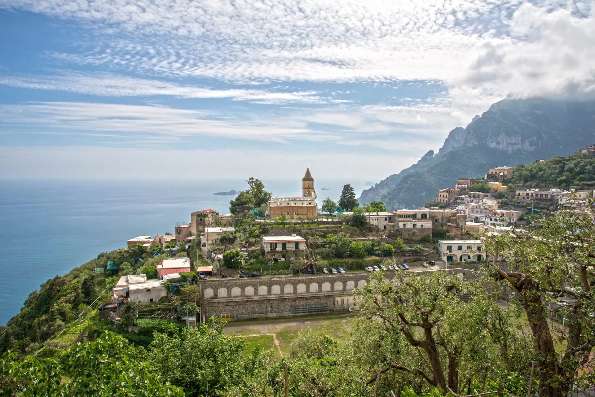 View of Montepertuso village with church tower above Positano overlooking the Mediterranean Sea.