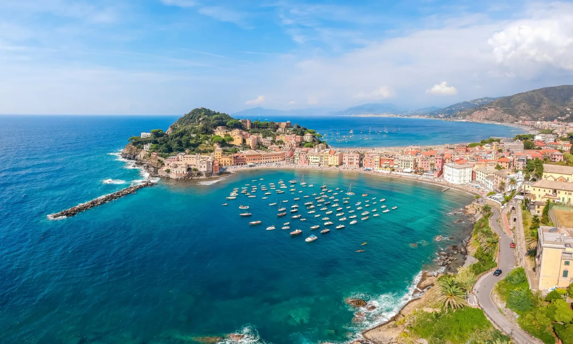 Sea aerial landscape in Sestri Levante, Liguria, Italy. Scenic fishing village with traditional houses and clear blue water. Summer vacation rich resort with picturesque harbour and nice sand beach