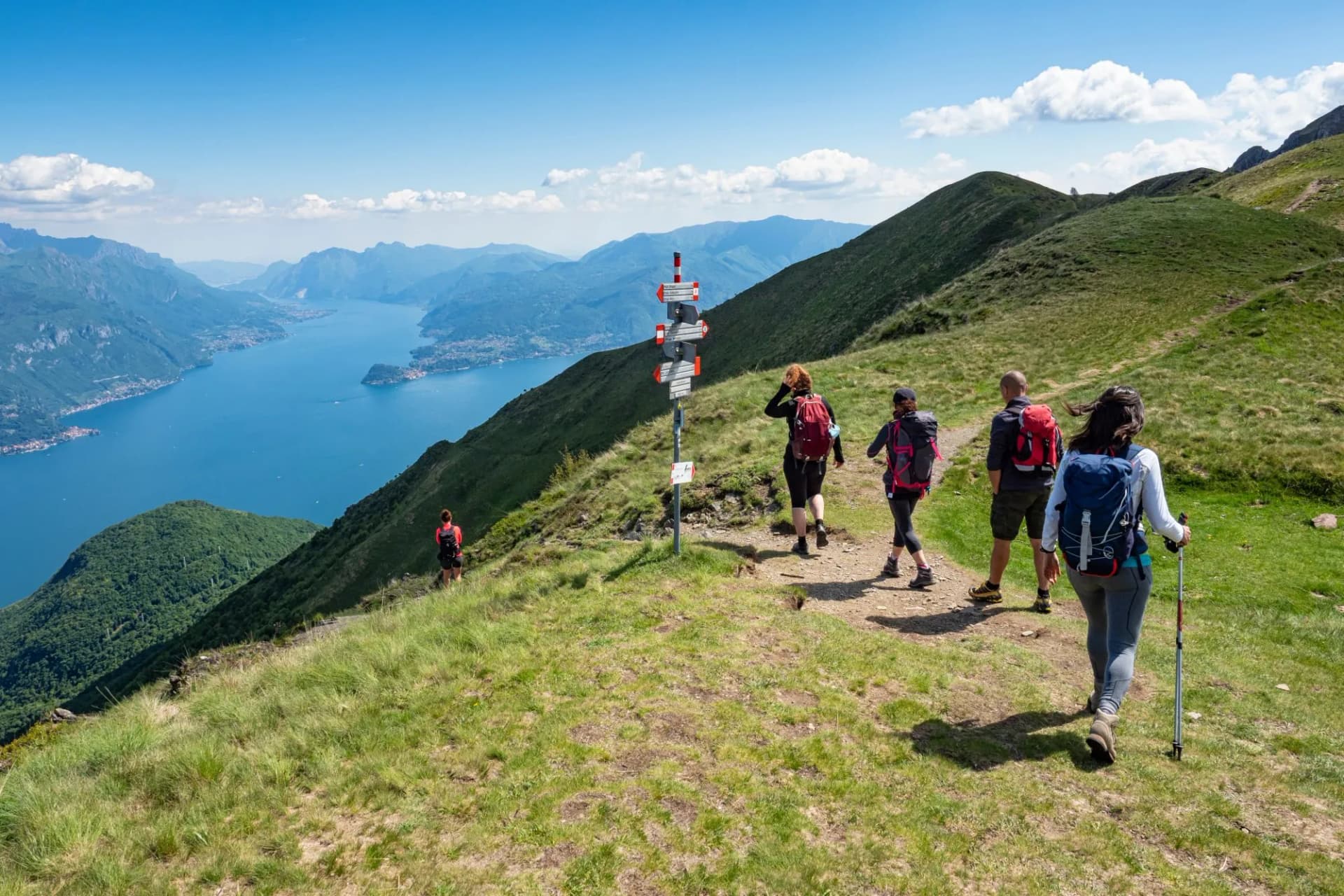 Trekking scene on Lake Como alps (the arrows indicates the names of the locations reached by the trails)
