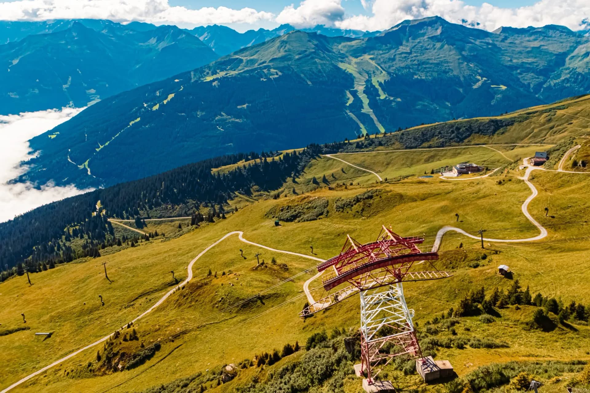 Alpine summer view above the fog in the valley at Schlossalmbahn cable car, Mount Kleine Scharte, Bad Hofgastein, St. Johann im Pongau, Salzburg, Austria