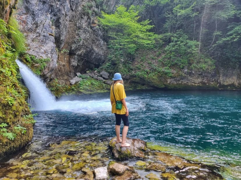 person on the Blue Eye waterfall in Albania