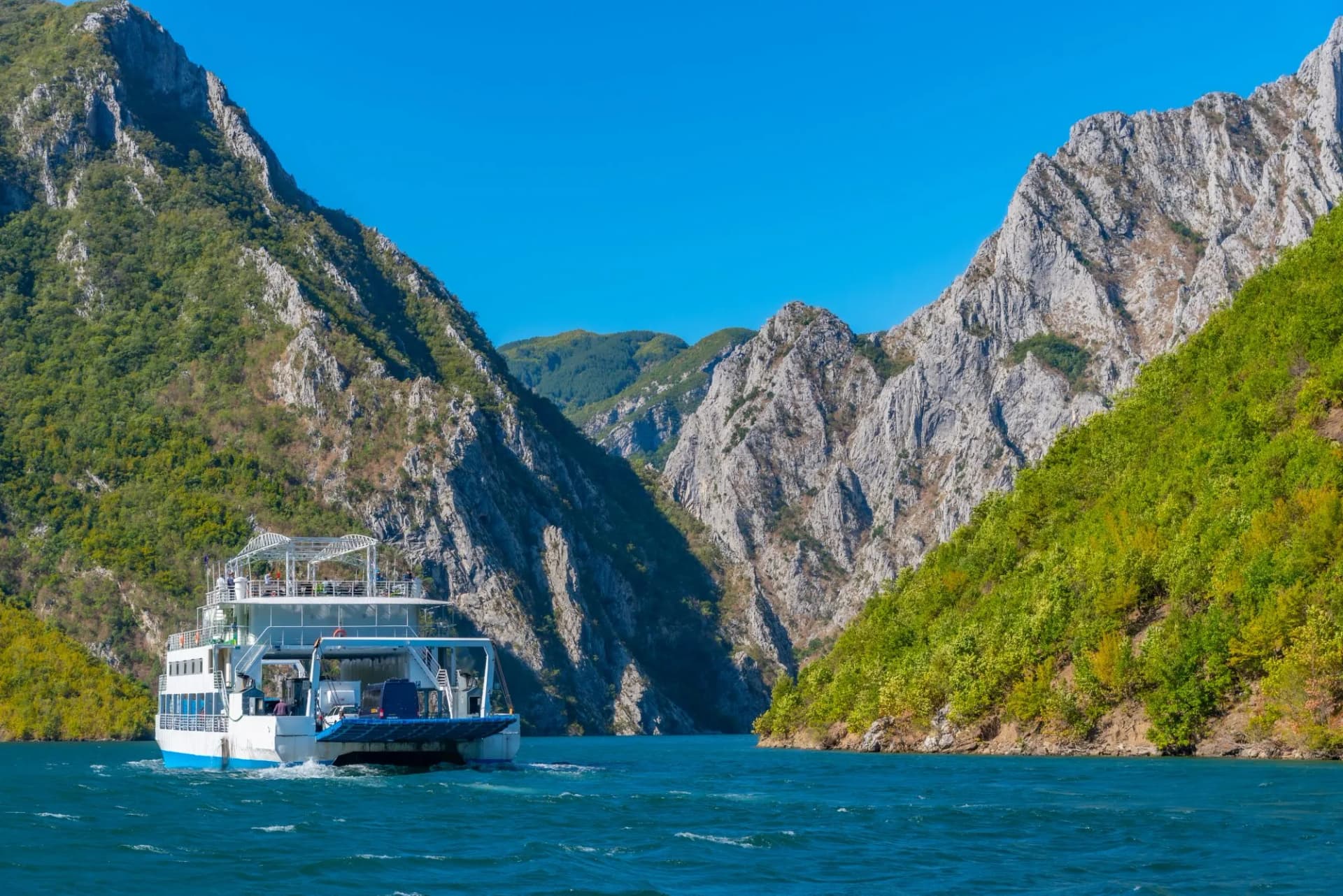 Ferry cruising lake Koman in Albania