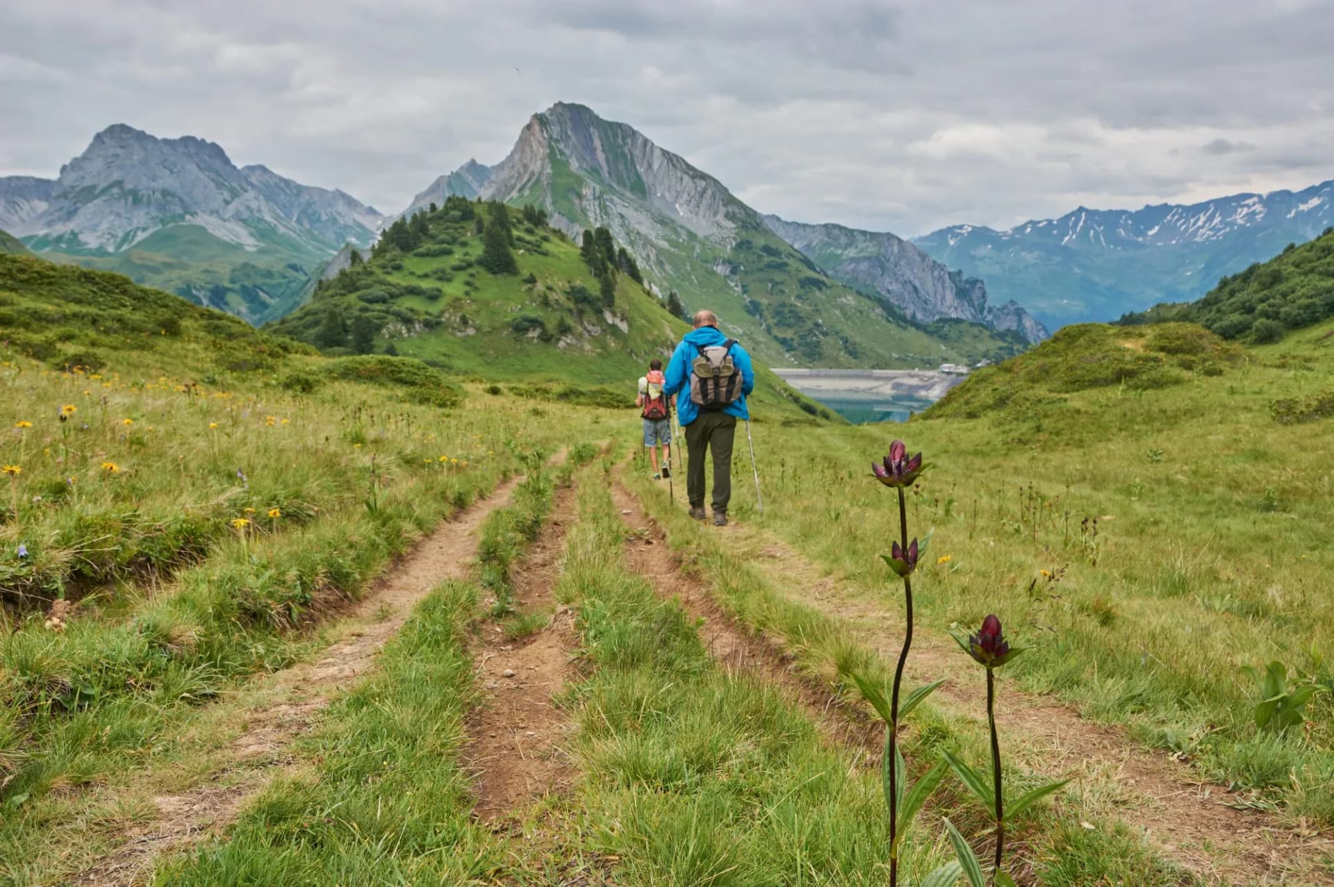 Hiking through the mountains in Vorarlberg, Austria. Hiking along the Lechweg in Austria. Hiking through a lonely mountain landscape in Austria. Hiking towards a mountain lake in Austria.