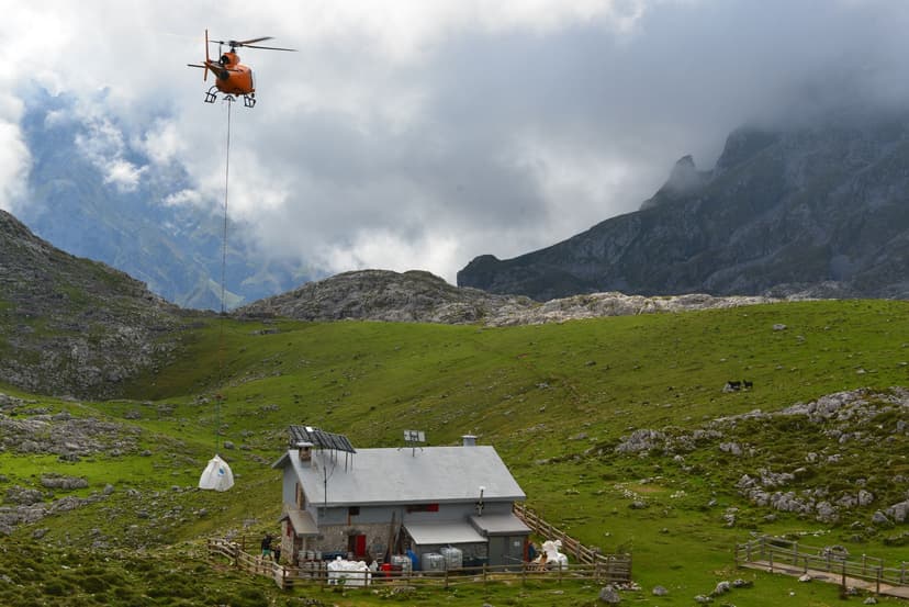 Helicopter delivering supplies to a mountain refuge in Picos de Europa