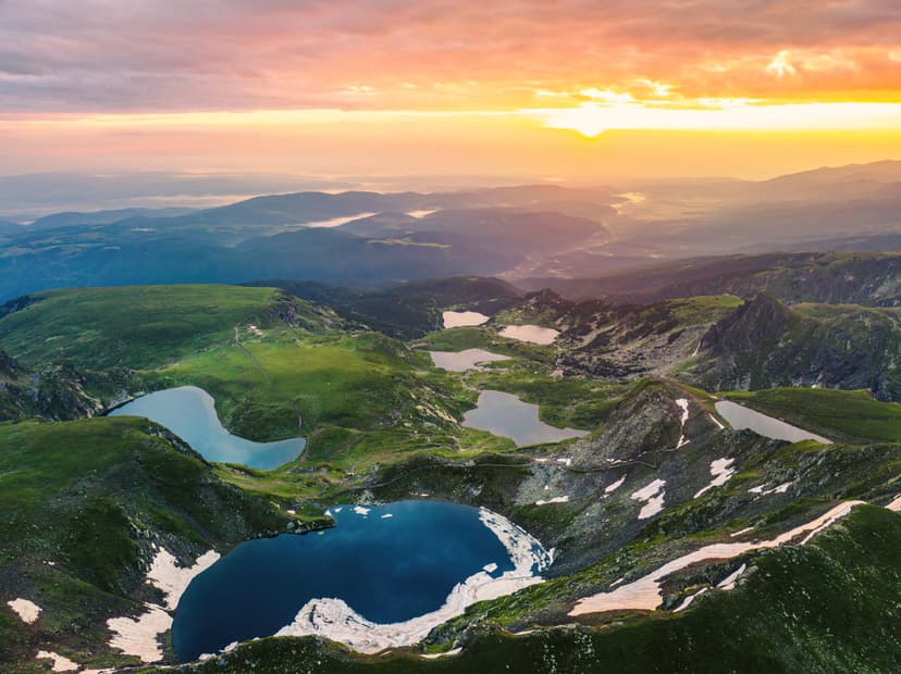 Aerial view of alpine lakes in mountain landscape during sunset