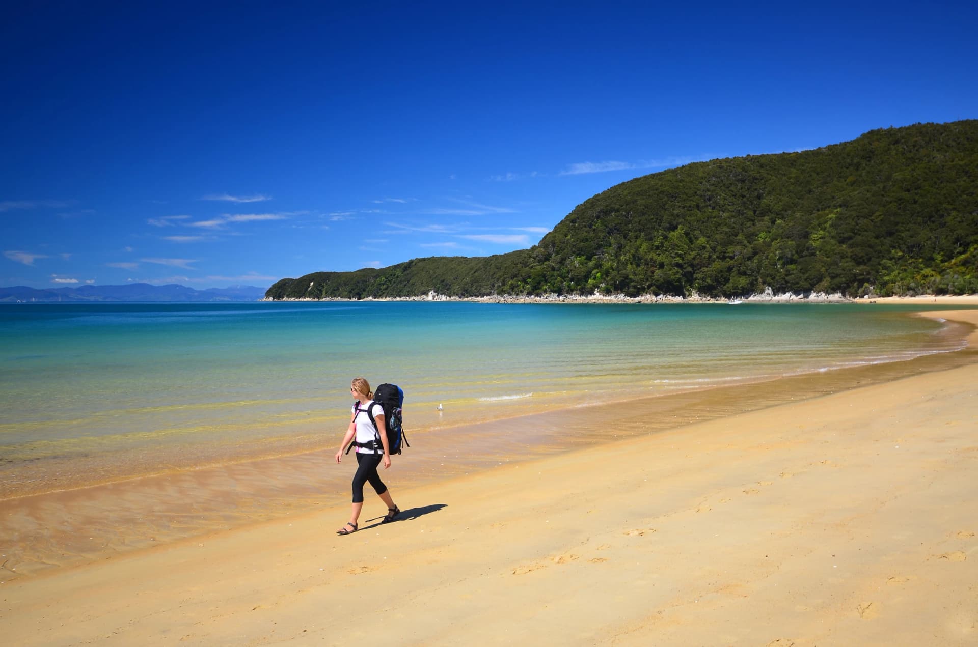 Women hiker on a beach