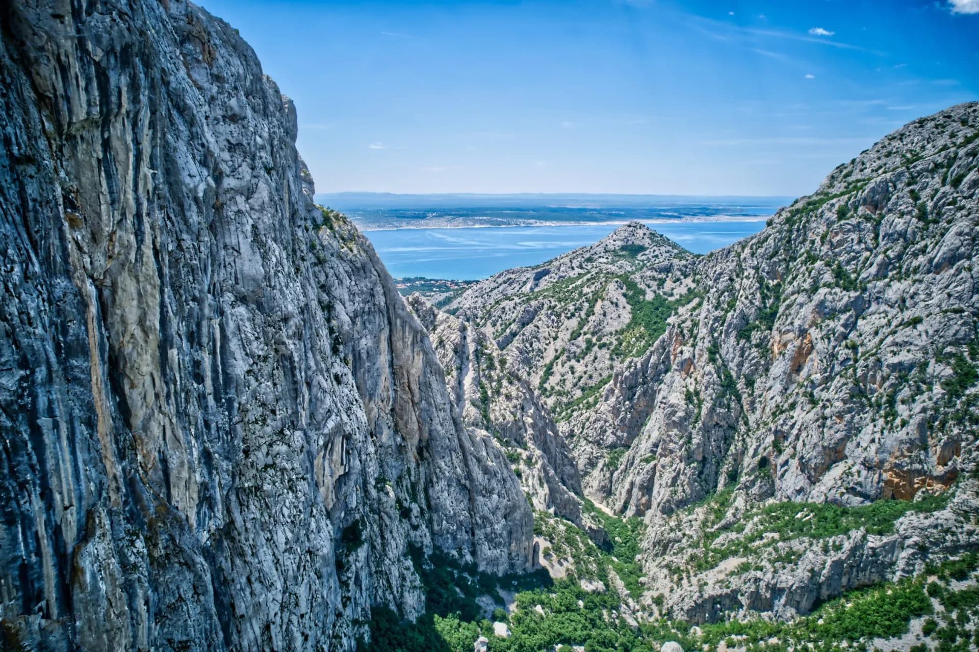 Steep rocky canyon walls overlooking the sea in Velika Paklenica National Park, Croatia.