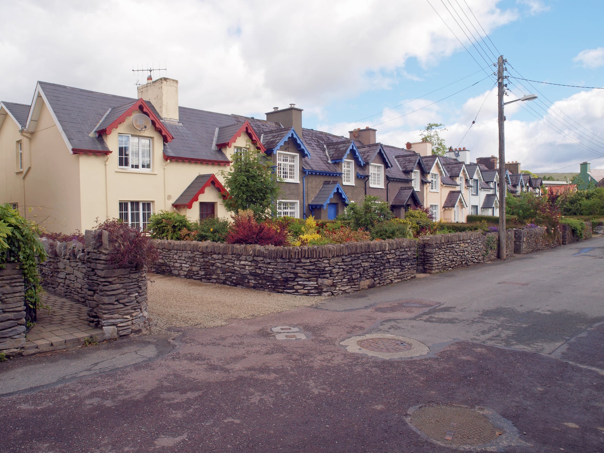 A row of painted cottages on a street in Kenmare