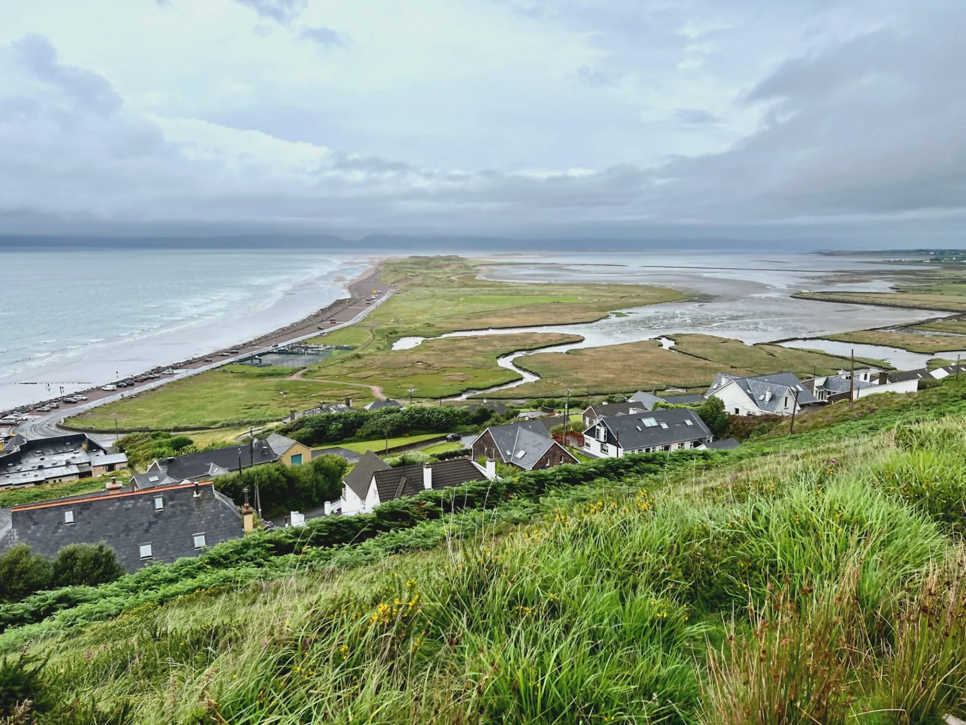 Grassy hillside above the village of Glenbeigh and the Rossbeigh sand spit