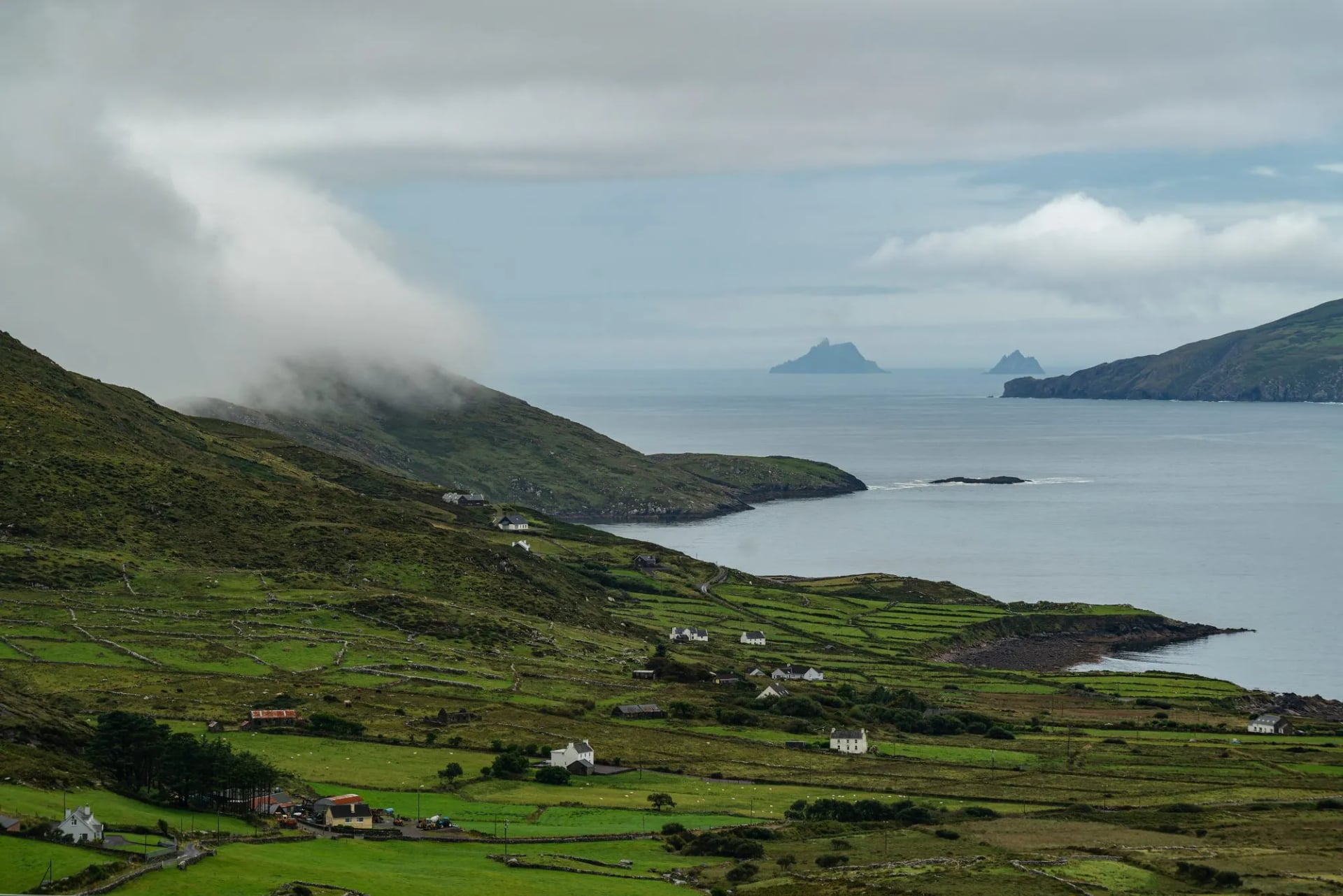 Low cloud over Ballinskelligs Bay with islands faint on the horizon