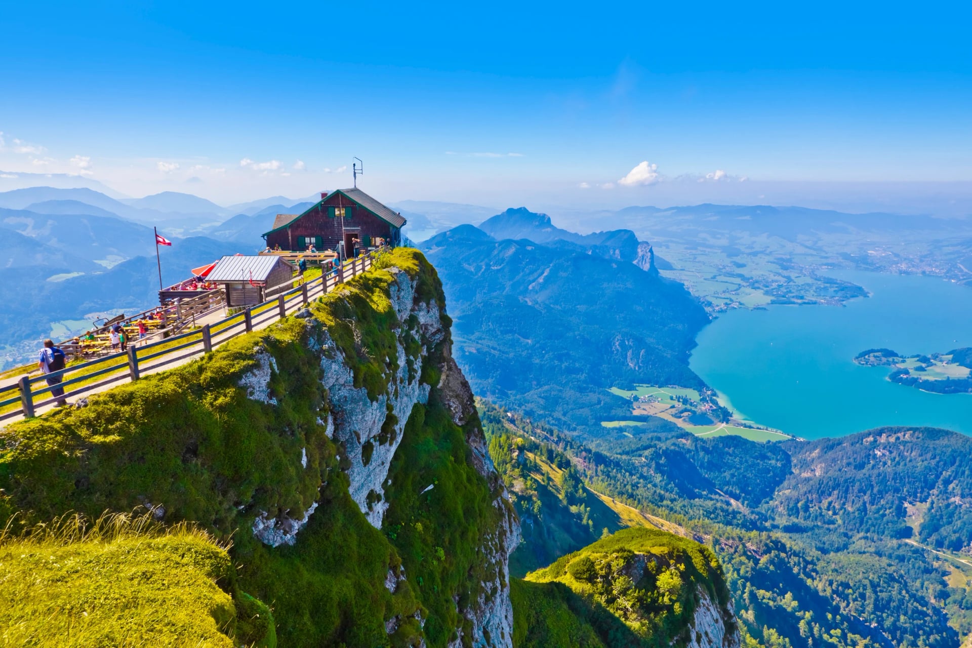 The summit hut on the Schafberg ridge with lakes far below