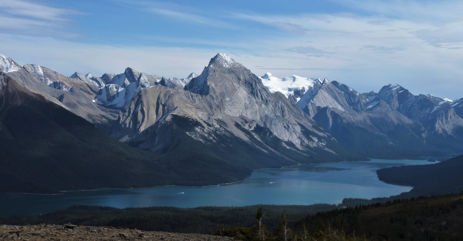 Maligne Lake seen from the open slopes of the Bald Hills with ranks of peaks beyond