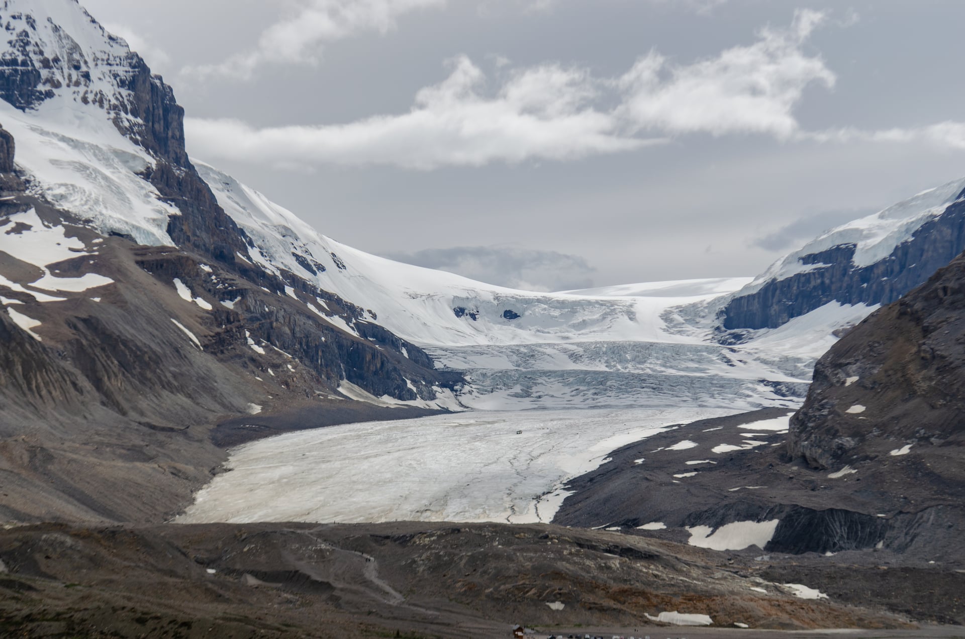 The tongue of the Athabasca Glacier spilling off the Columbia Icefield between bare rock ridges