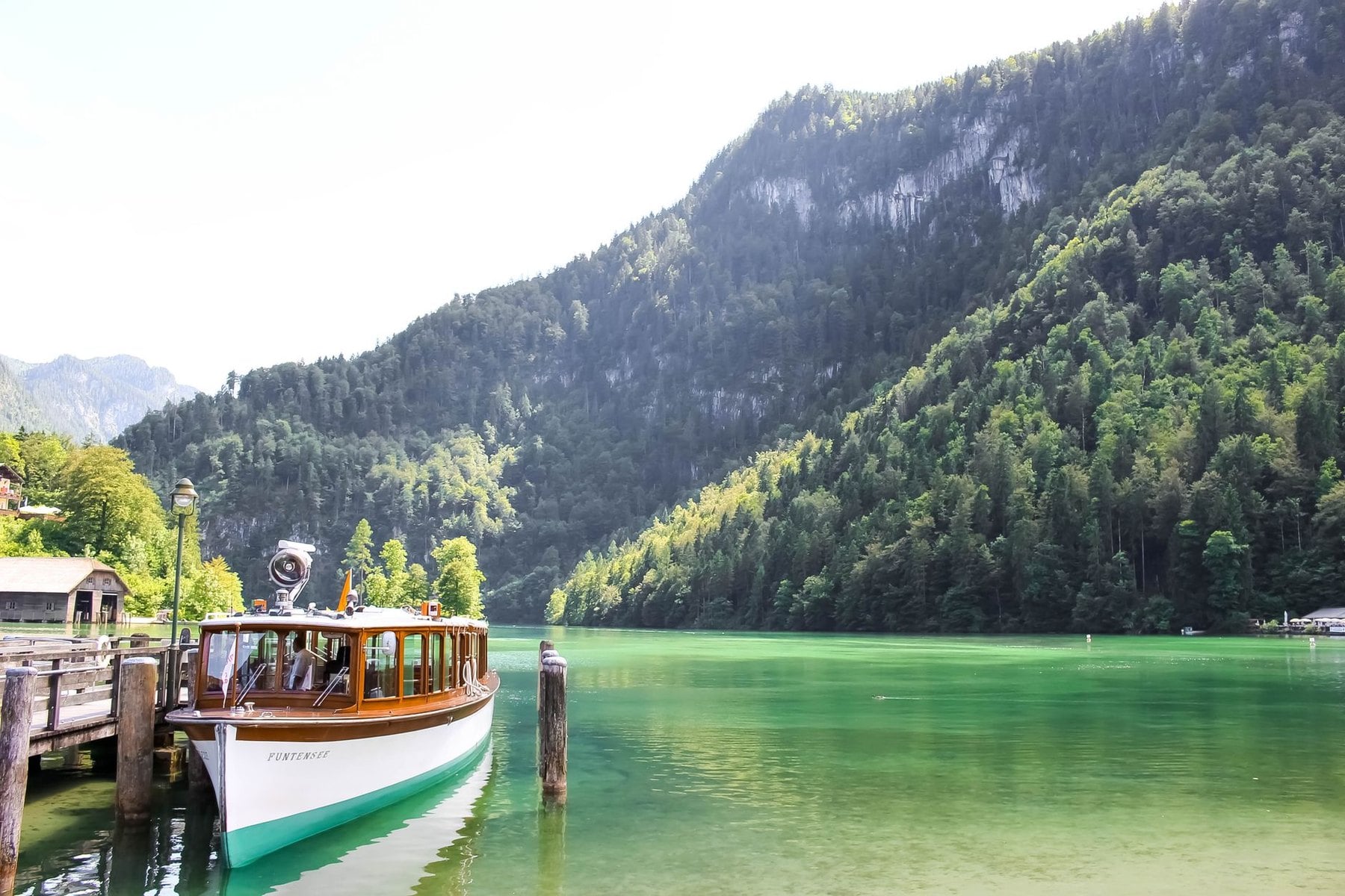 An excursion boat on the green water of the Königssee