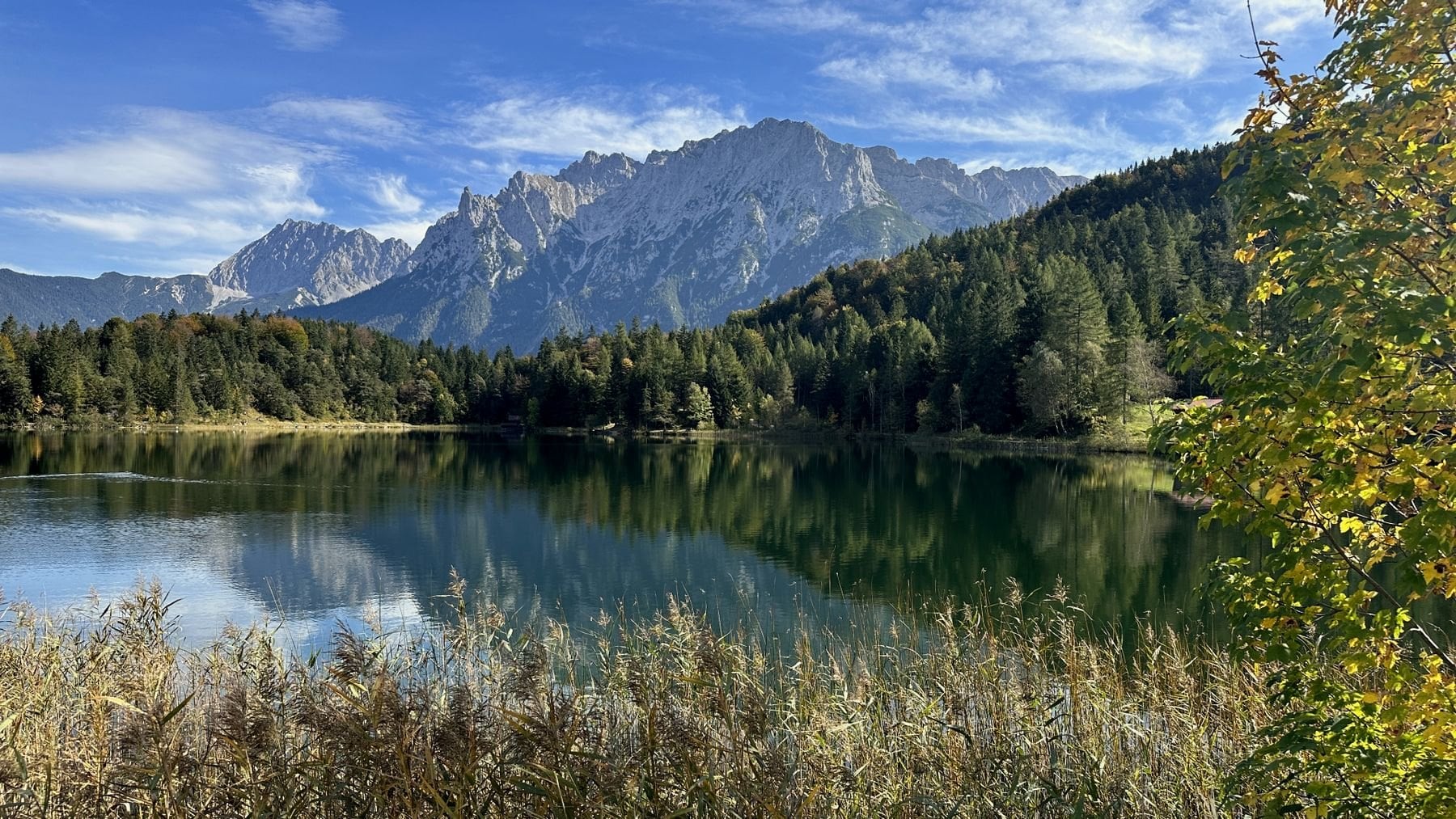 A still lake reflecting the mountains at Mittenwald