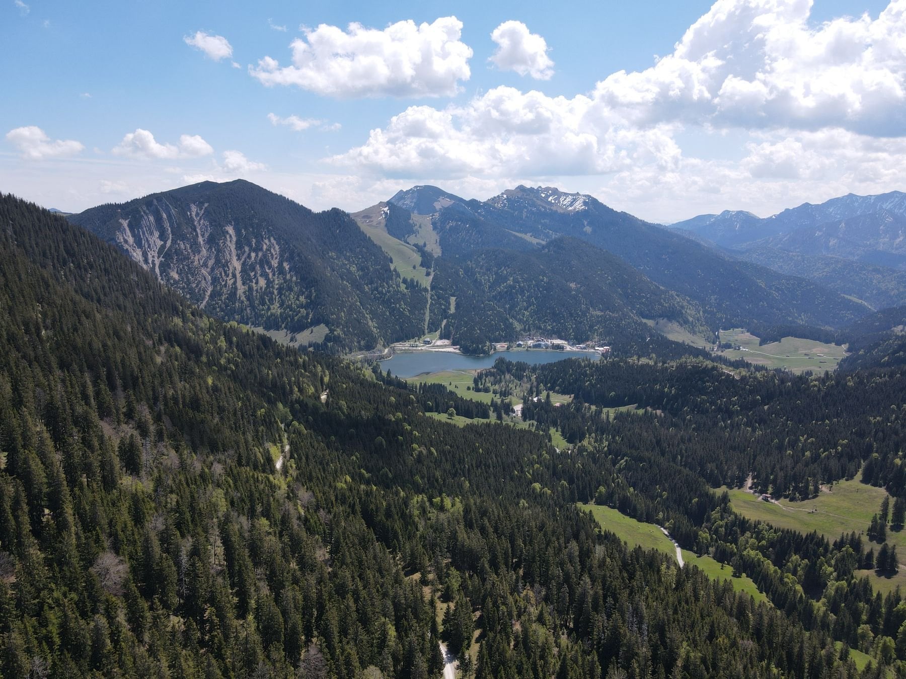 Aerial view of Schliersee lake among forested hills