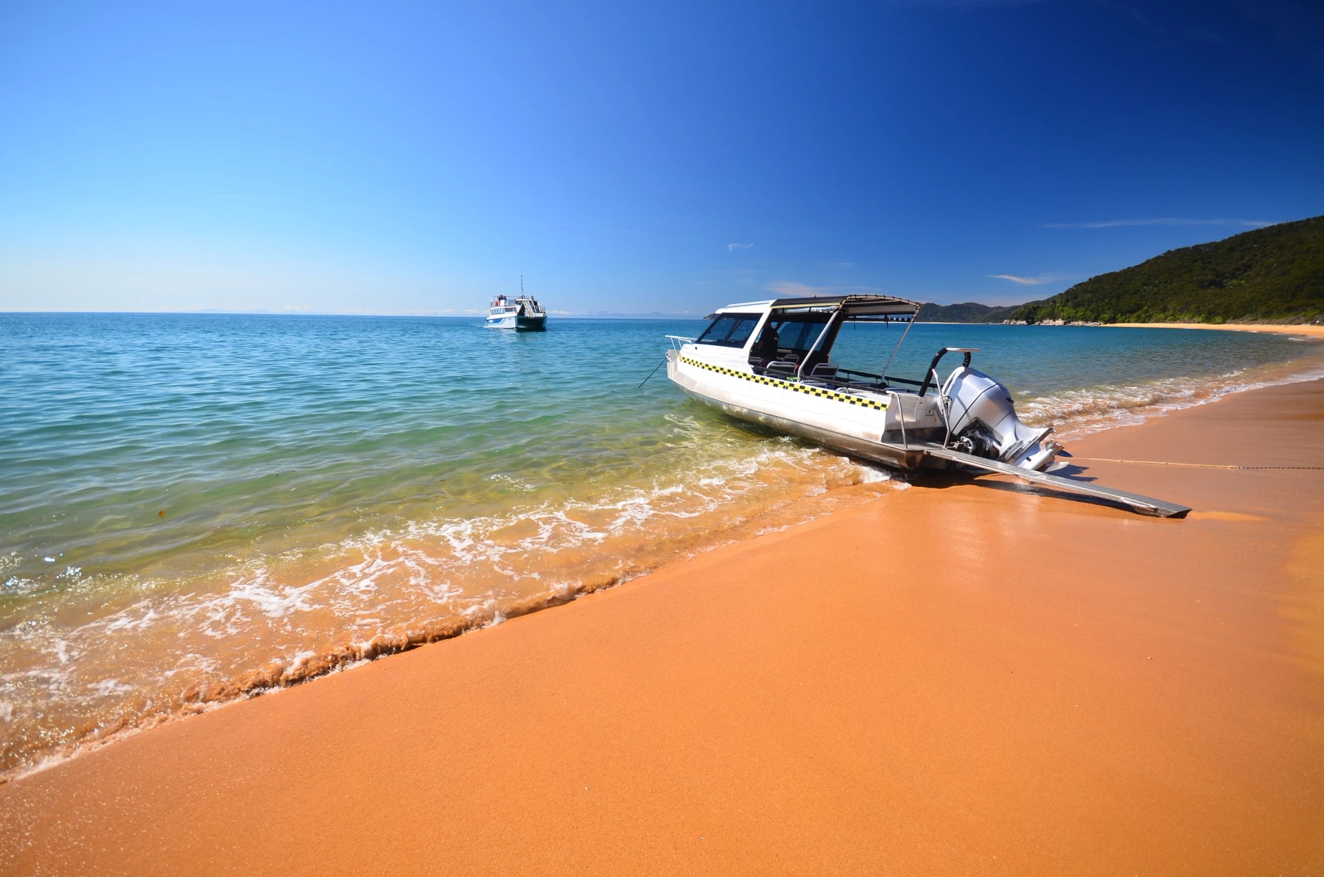 Water taxi on a golden beach