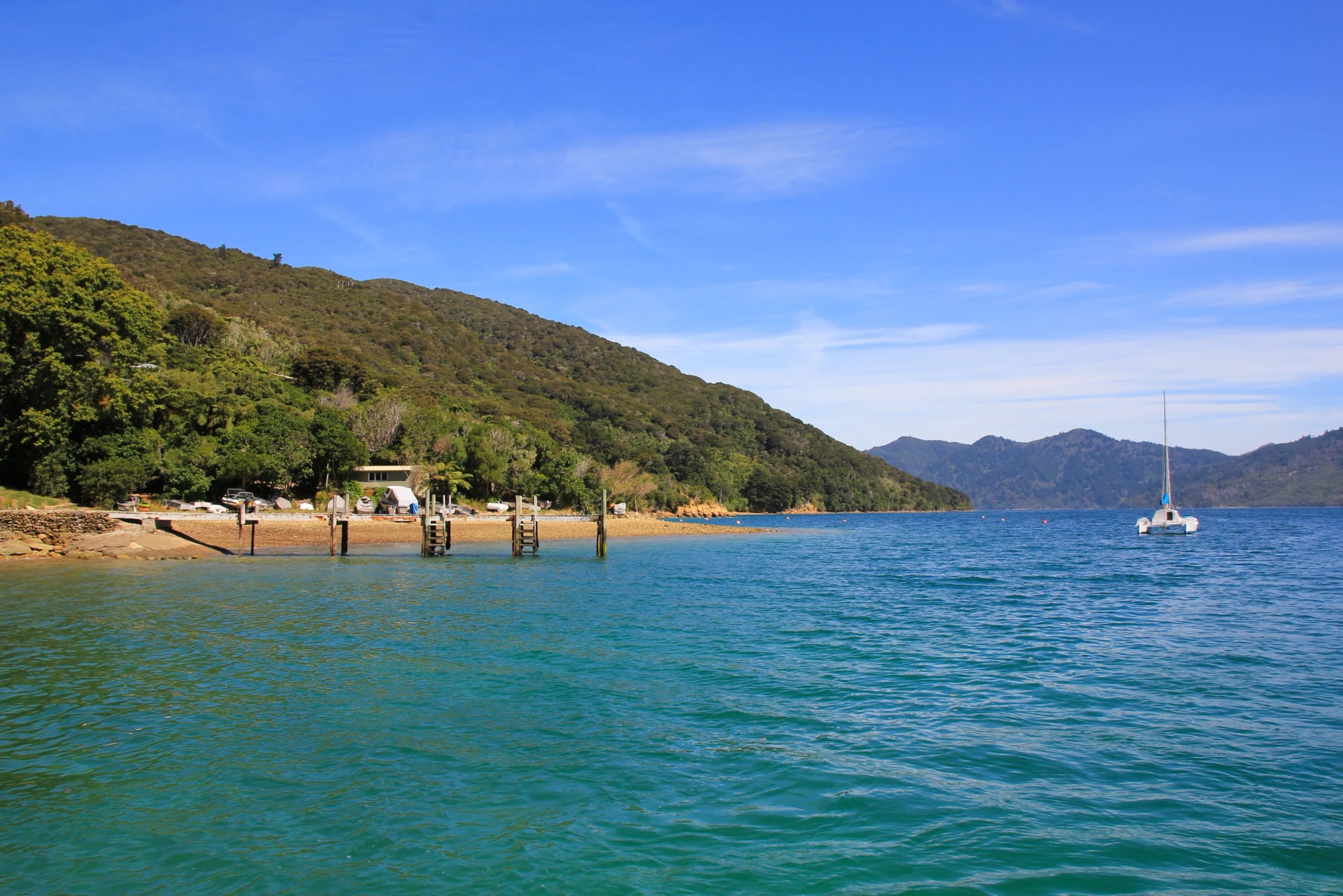 Jetty and boat in a bay of Queen Charlotte Sound