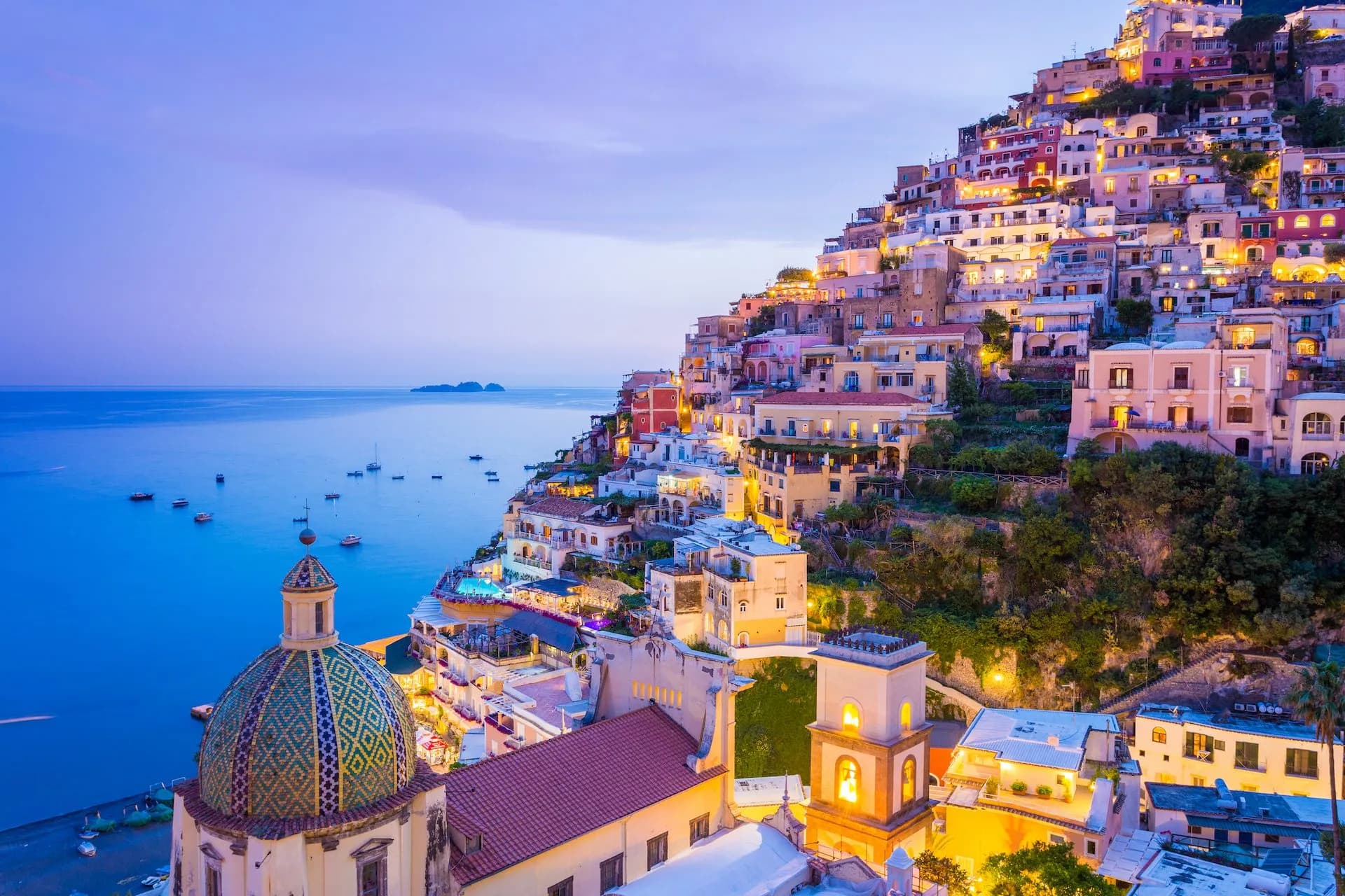 View of the Positano town and the seaside in a summer sunset.