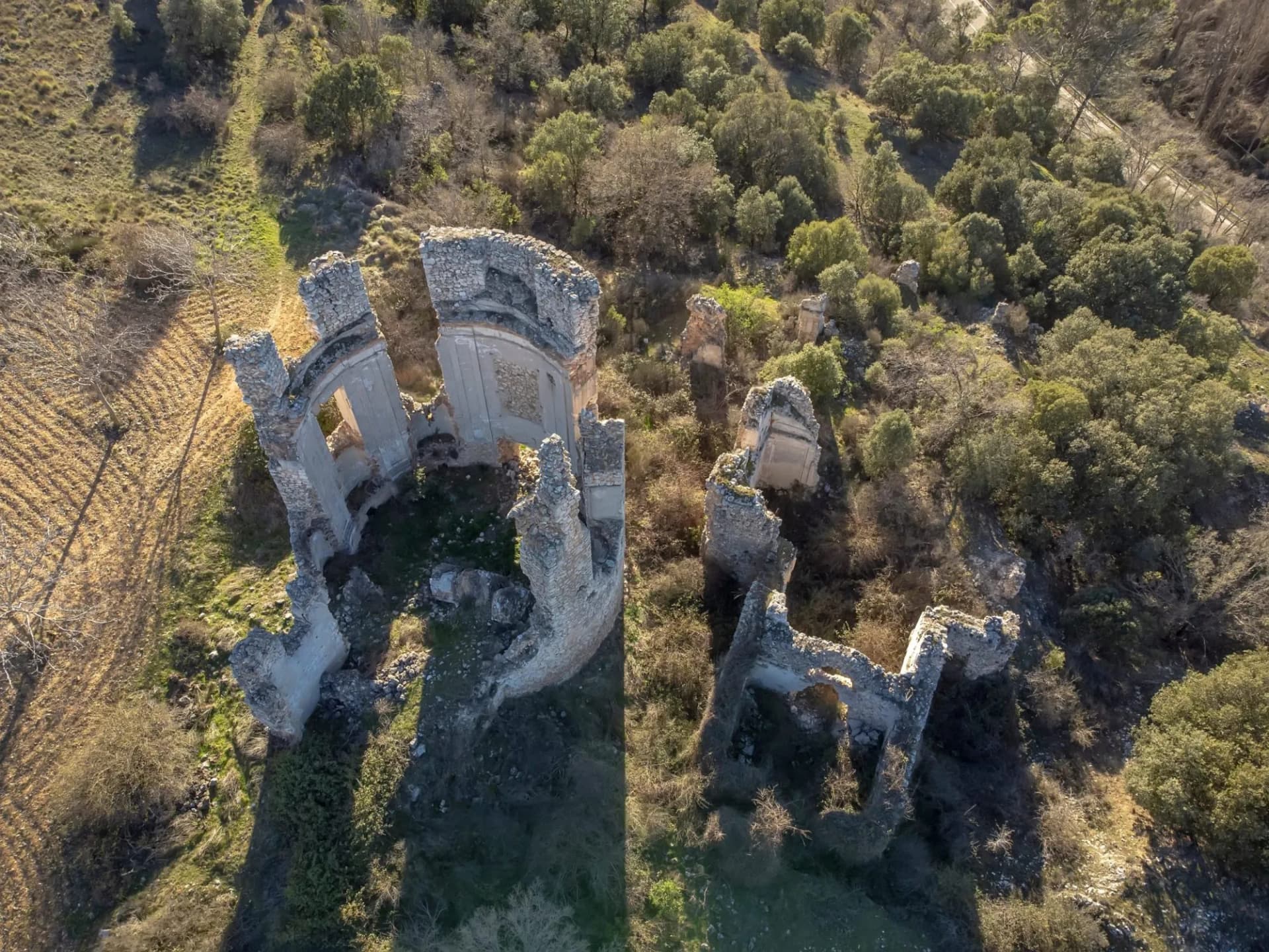 aerial view of the ruins of a monastery with a crenellated tower, drone view, convent of la Salceda, Tendilla, Guadalajara, Spain, horizontal, ruined church