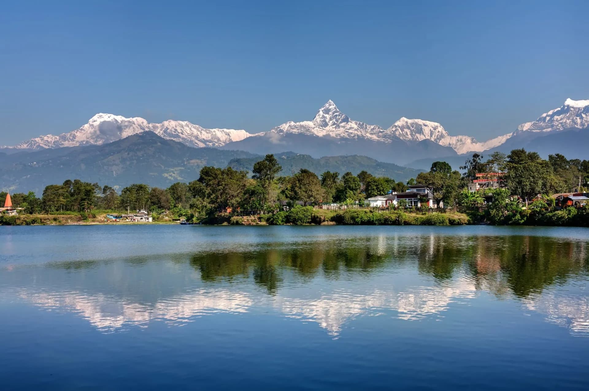 View at Annapurna mountain range and its reflection in Phewa lake