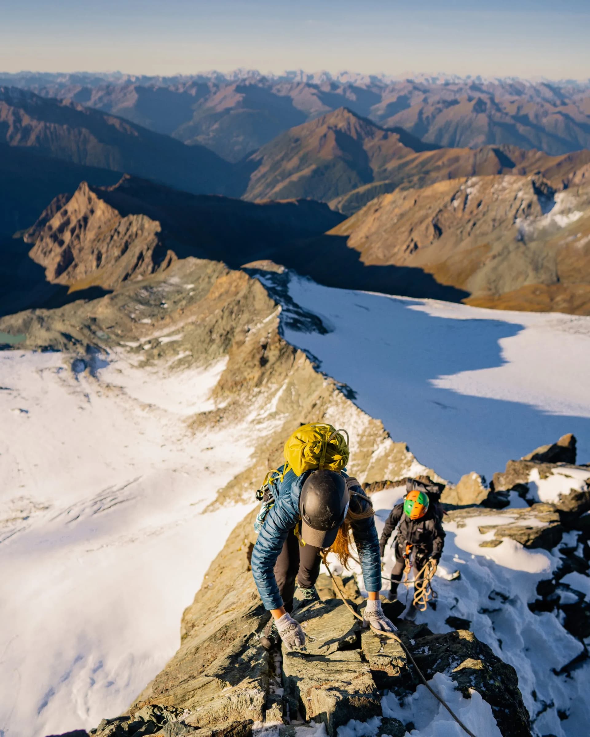 Rock climber on Studlgrat ridge on Grossglockner, highest mountain in Austria. Concept of alpine rock climbing.