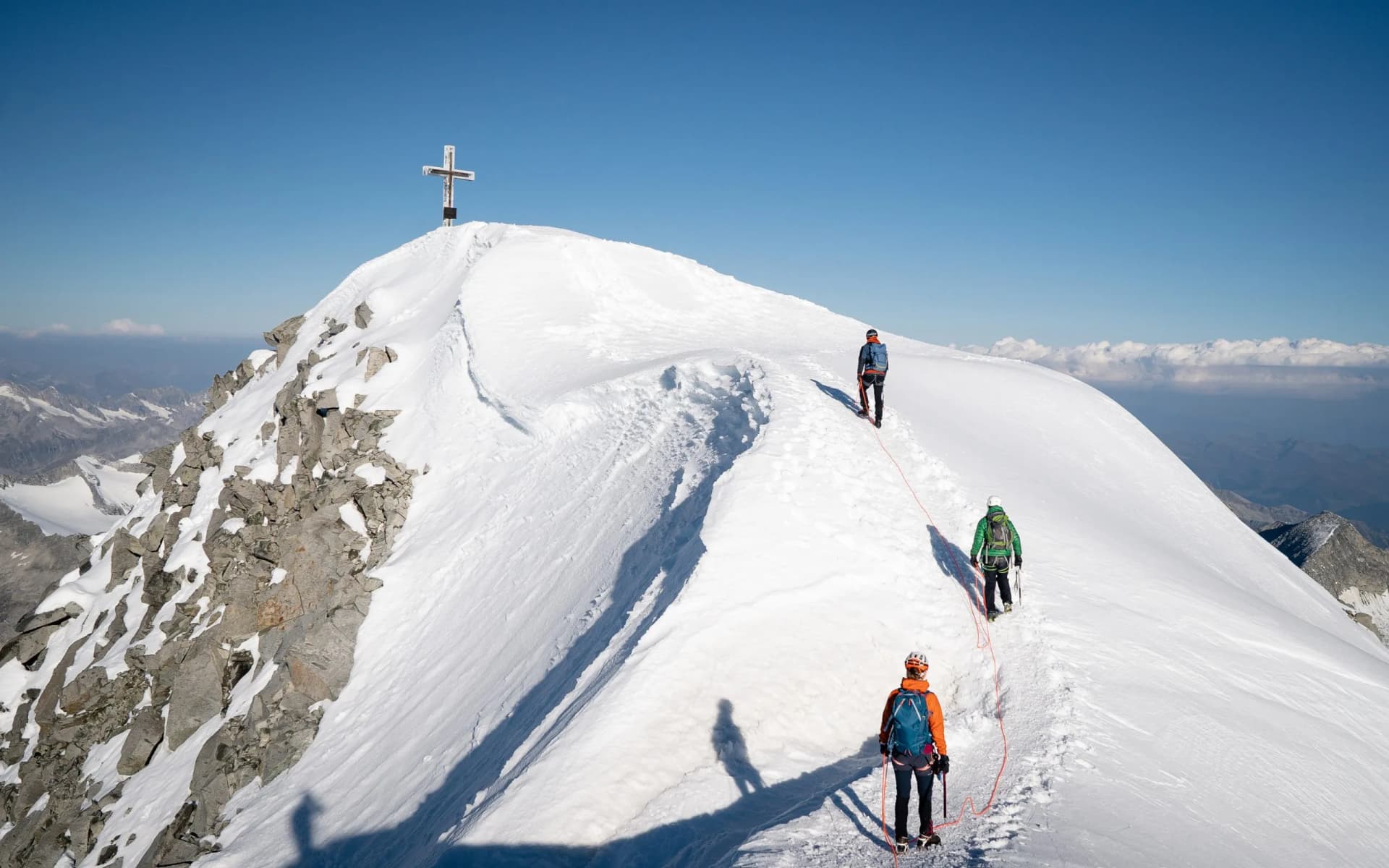Panoramic view of a group of alpinist on the way up to the top. Whole route over the glacier. GrossVenediger, Summer in The Alps, Austria