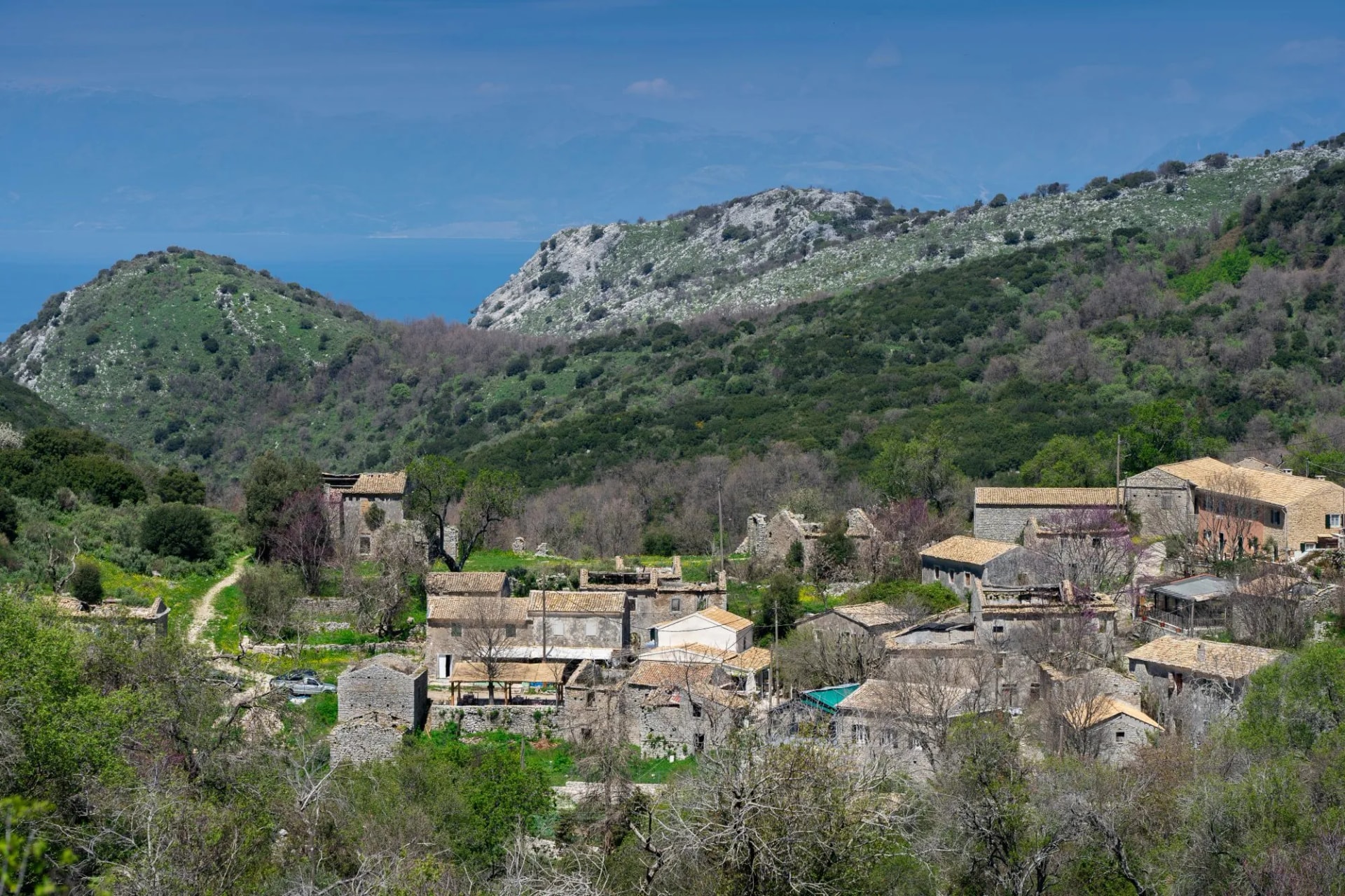 Old abandoned stone-built houses in Old Perithia at Pantokrator Mountain, Corfu. This is simply a ghost town located on the North of Corfu green island. Discover the history of greek empire (Greece)