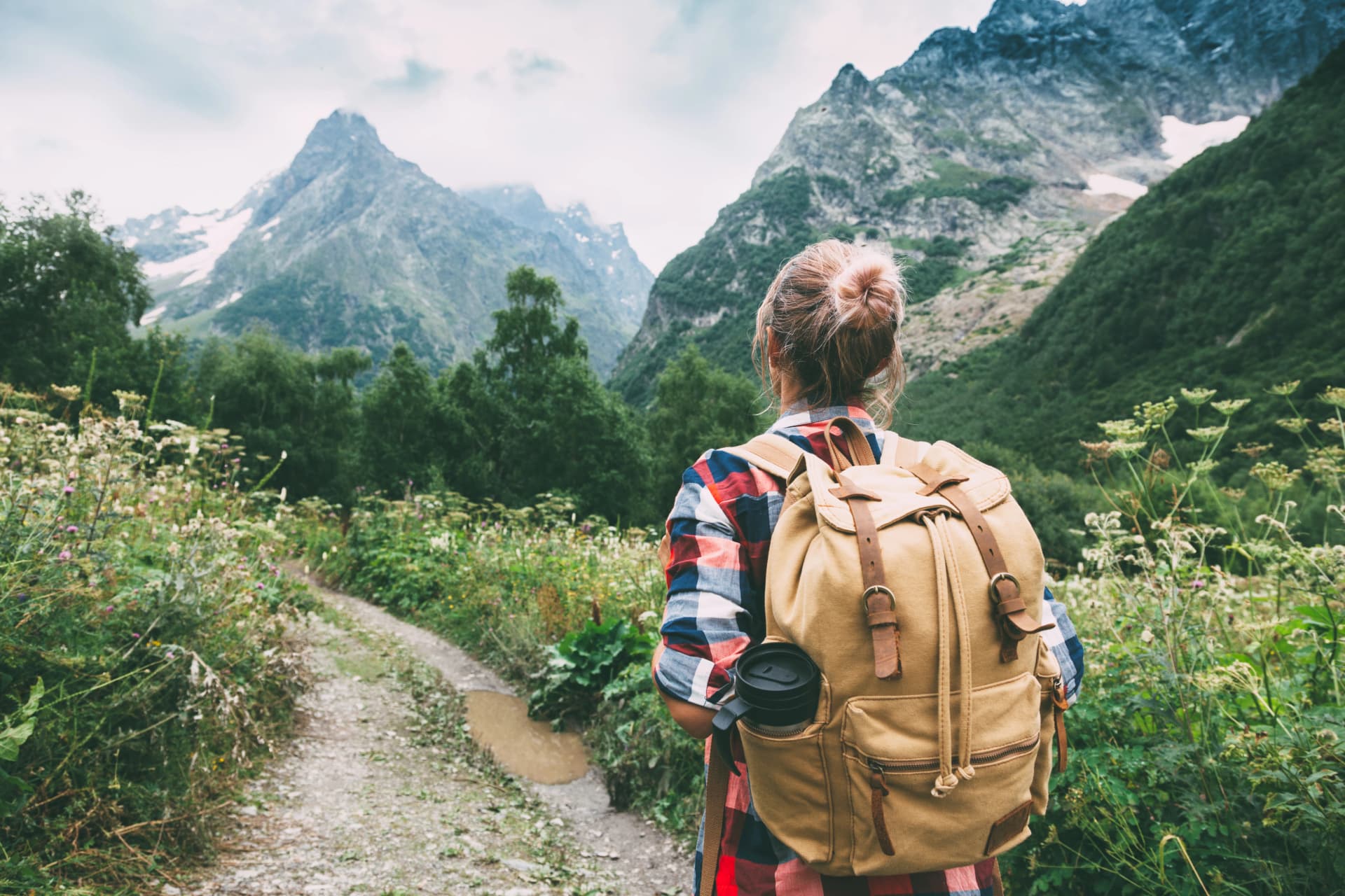 Hiker walking to mountains