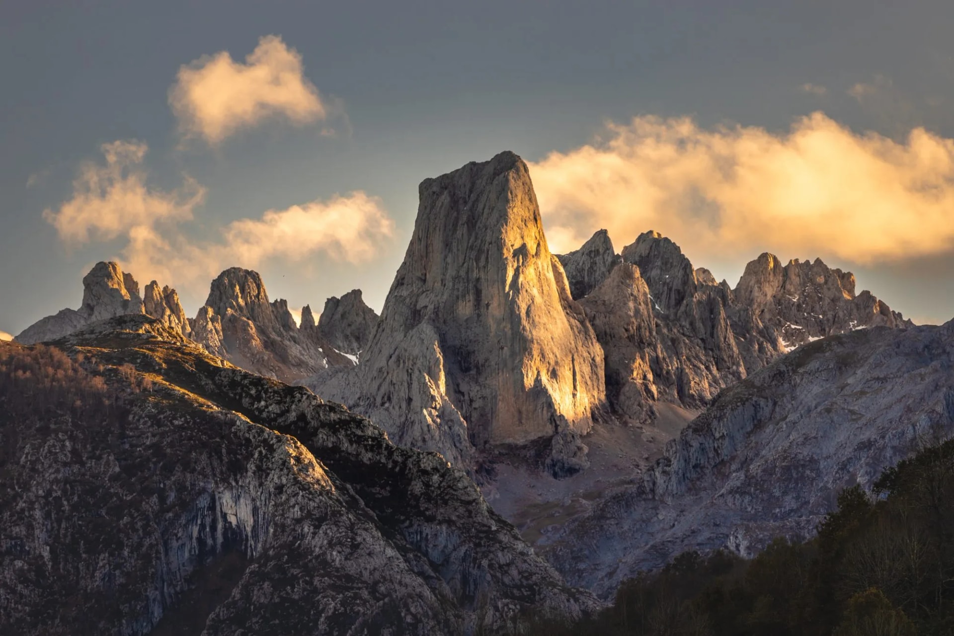 Close-up of Naranjo de Bulnes peak illuminated by sunset in Picos de Europa, Asturias, Spain.