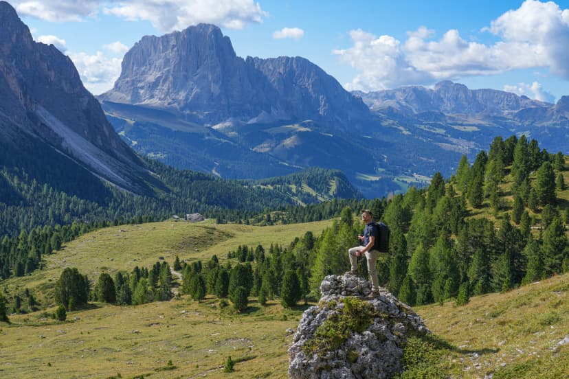 A man observes the surroundings in Puez -Odle natural park