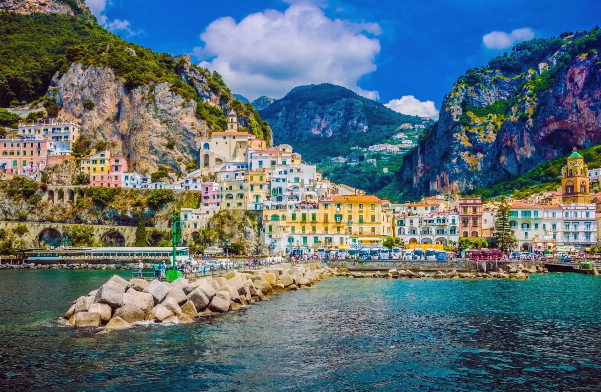 Wonderful Italy. The small haven of Amalfi village with a turquoise sea and colorful houses on the slopes of the coast.