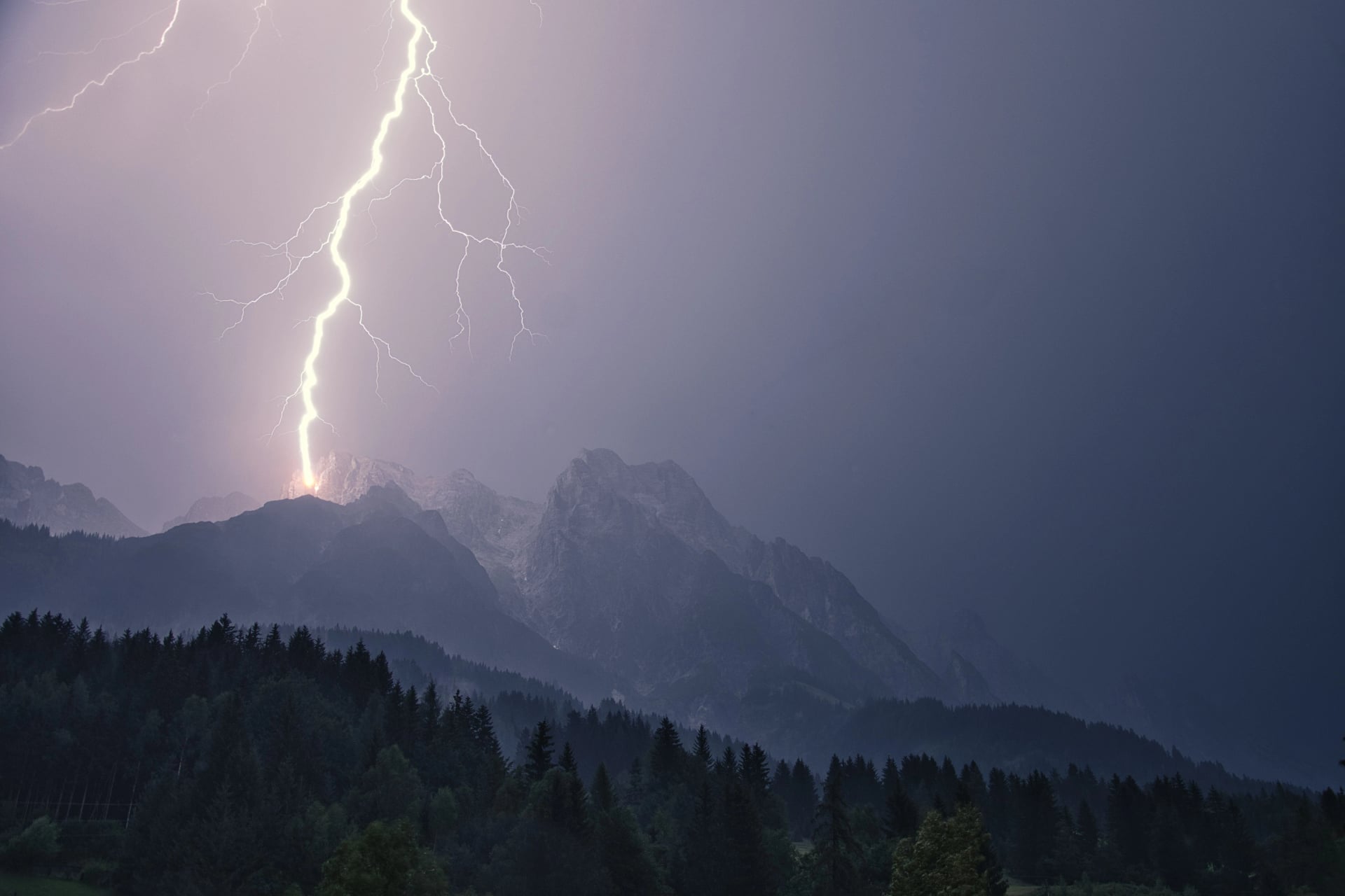 Dramatic lightning strike during a thunderstorm in the Steinberg in Leogang, Salzburg, Austria