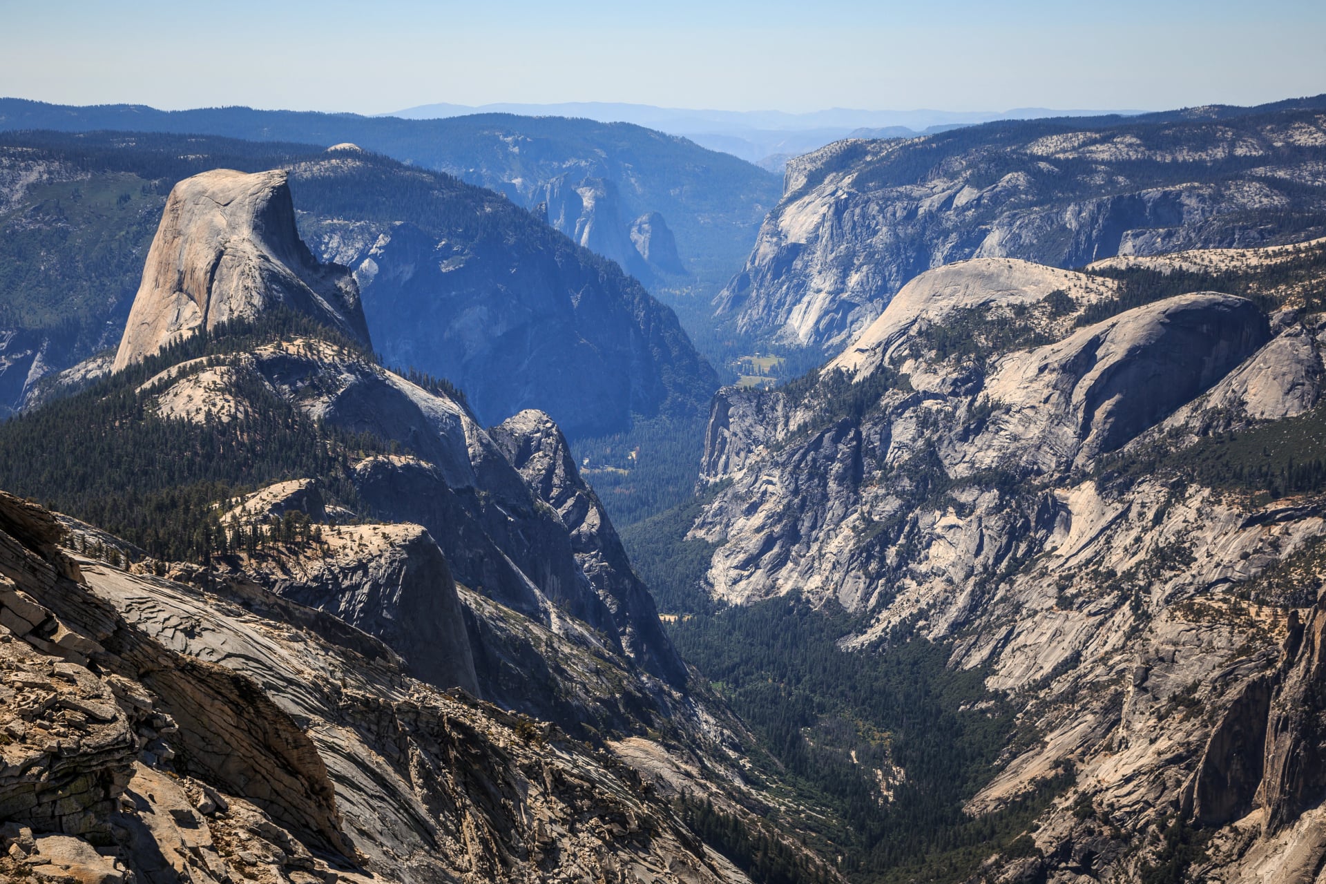 Half Dome rising above Tenaya Canyon seen from the granite of Clouds Rest