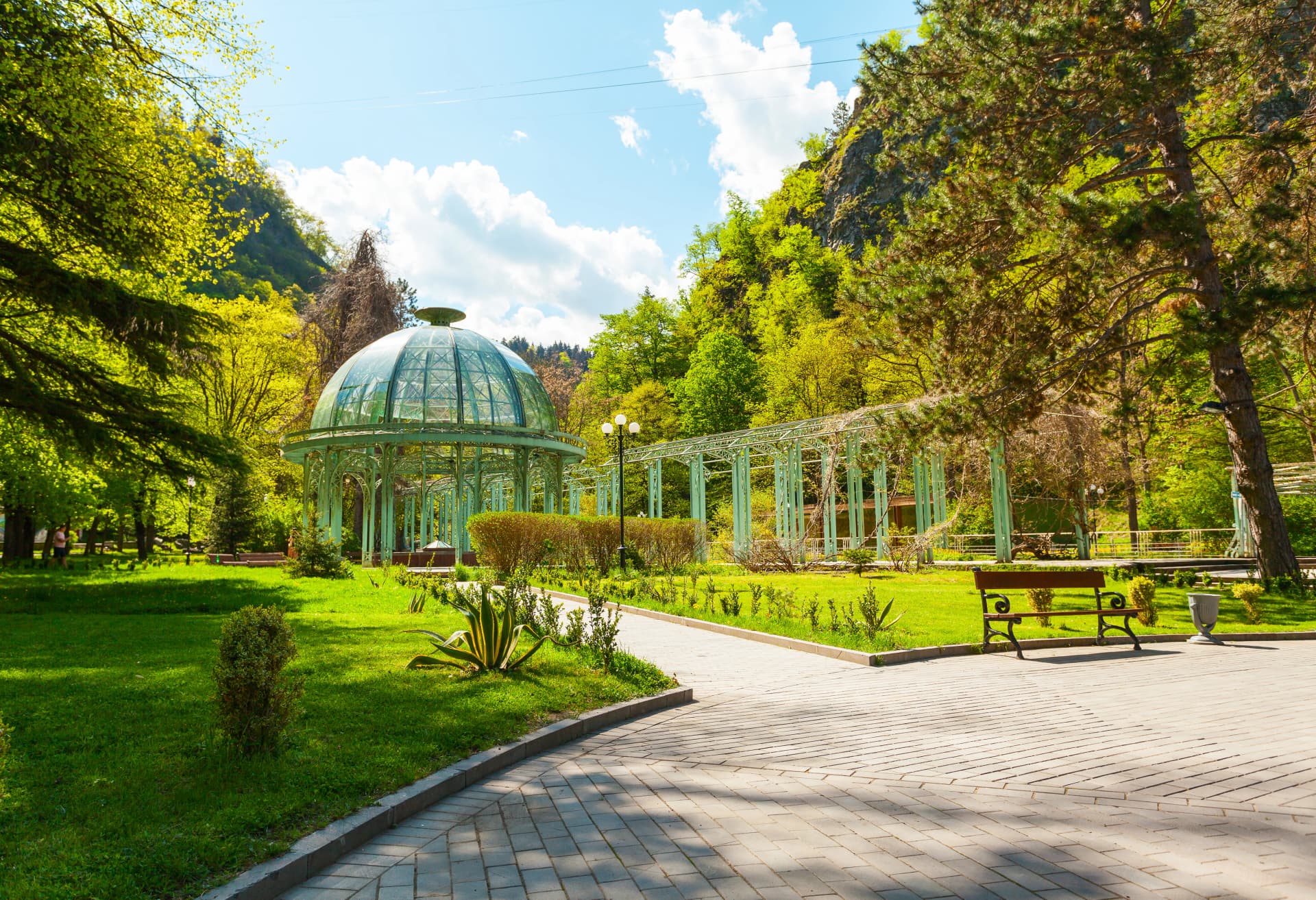 Borjomi Central Historical Park. Georgia. Source with healing mineral water. Beautiful pavilion with a glass dome.