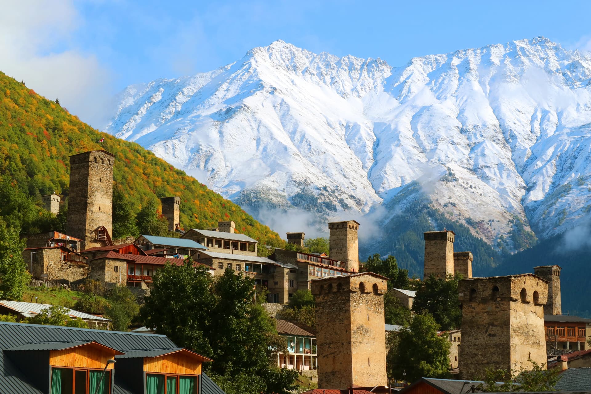 Stunning View of Medieval Svan Tower-houses against the Snow-capped Caucasus Mountain in Mestia, Svaneti Region of Georgia
