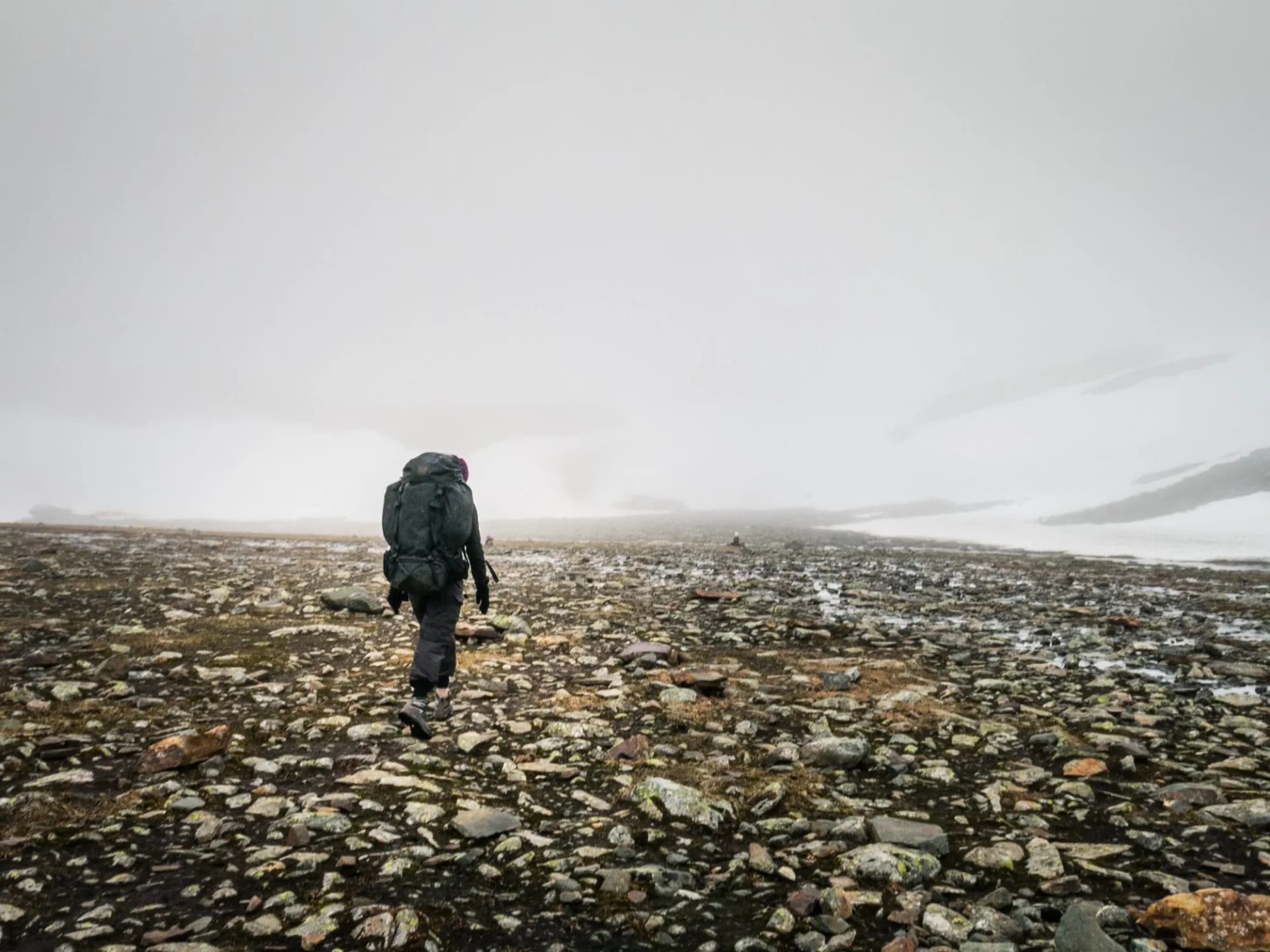 hiking in the mountains in fog and clouds