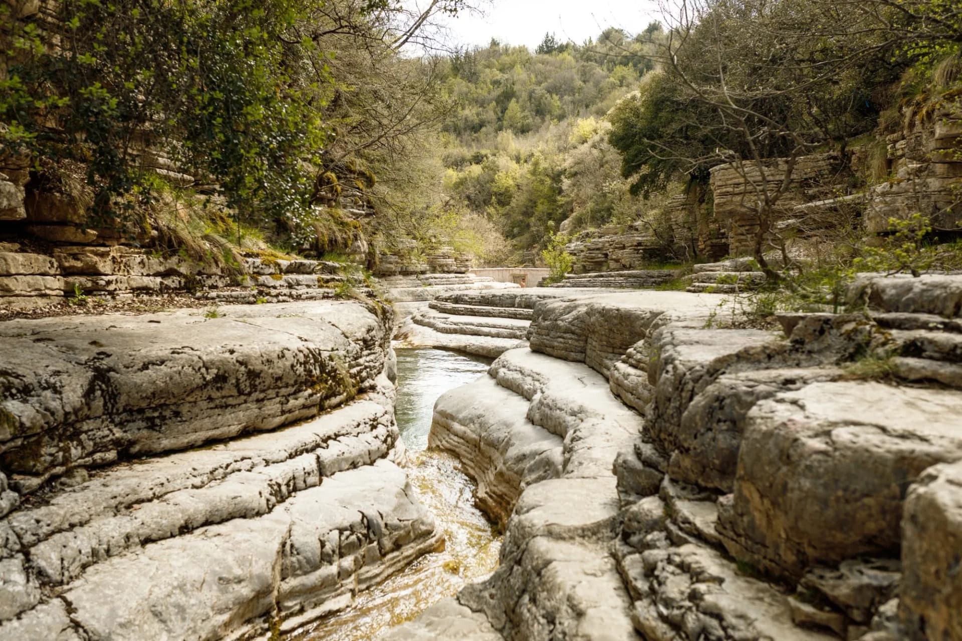 Papingo rock pools in Northern Greece with green waters near the village of Papingo in Zagori region