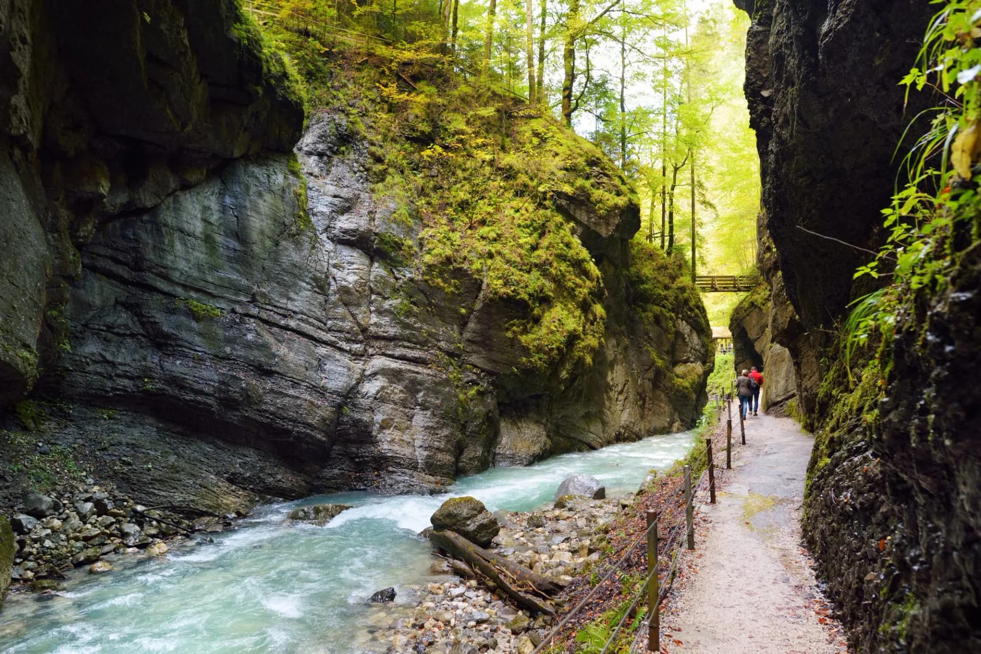 Blue water flowing in the Partnach Gorge or Partnachklamm, incised by a mountain stream in the Reintal valley near the town of Garmisch-Partenkirchen.