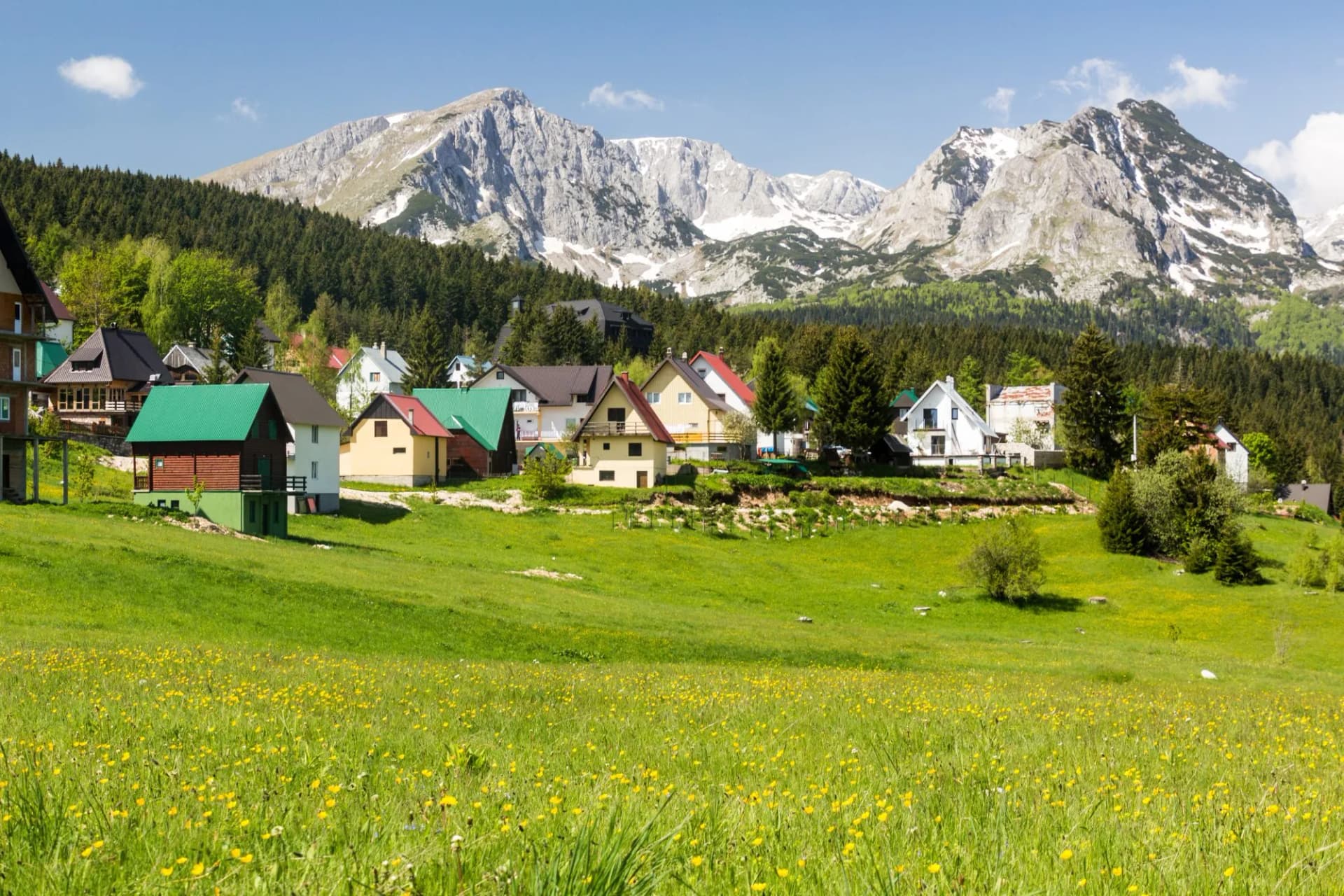 Houses of Zabljak village and peaks of Durmitor mountains, Montenegro.