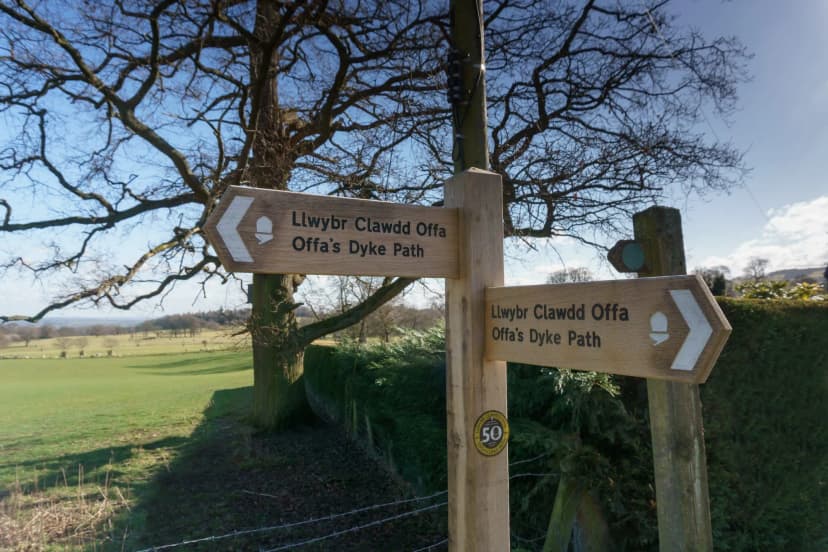 Offa's Dyke public footpath sign in English and Welsh languages in Chirk Wales a 177 mile long walking trail in the UK