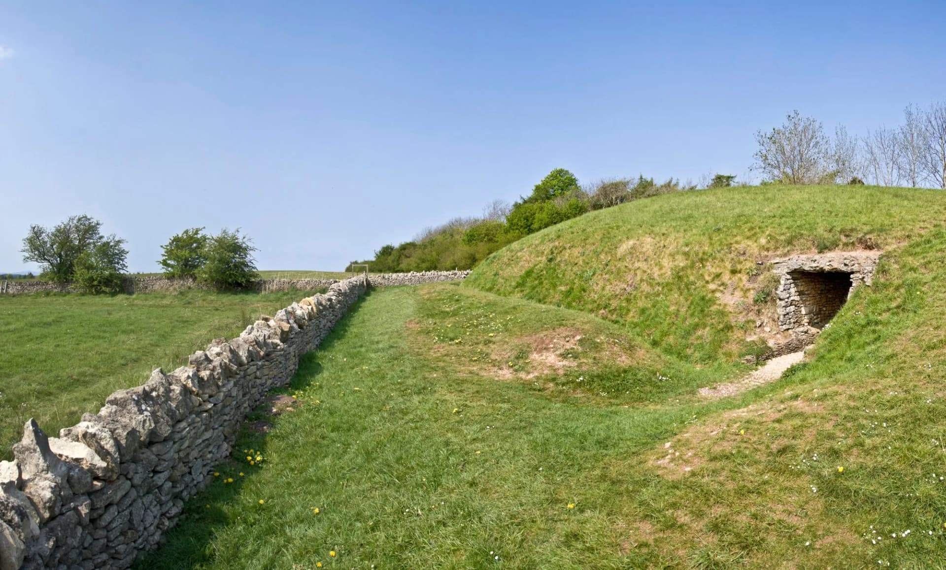 Belas Knap is a neolithic, chambered long barrow situated on Cleeve Hill, near Cheltenham and Winchcombe, in Gloucestershire, England.
