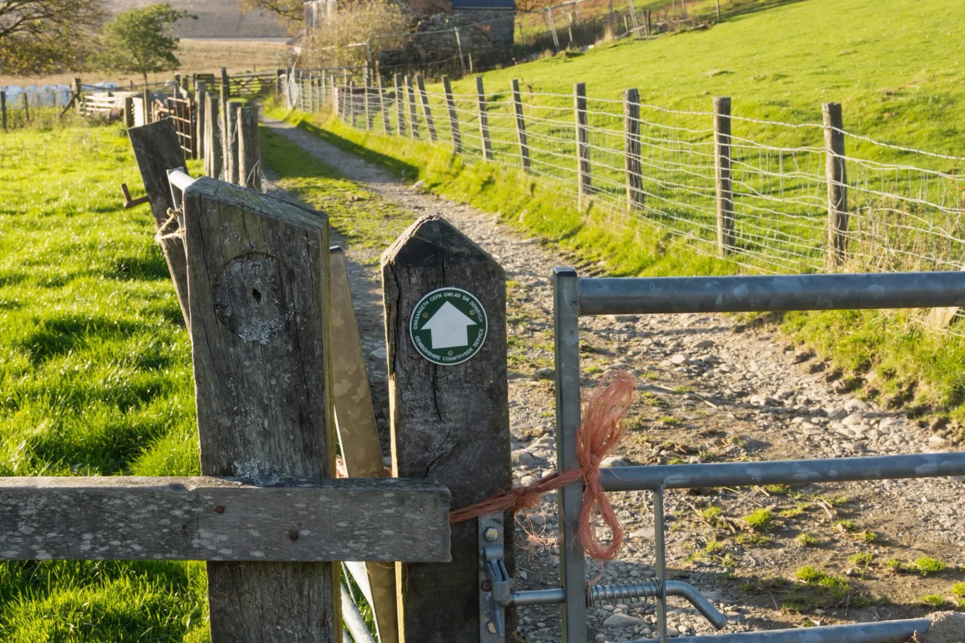 Stile and guide post or waymarker on a walking trail at Llyn Brenig reservoir on the Denbigh moors in North Wales