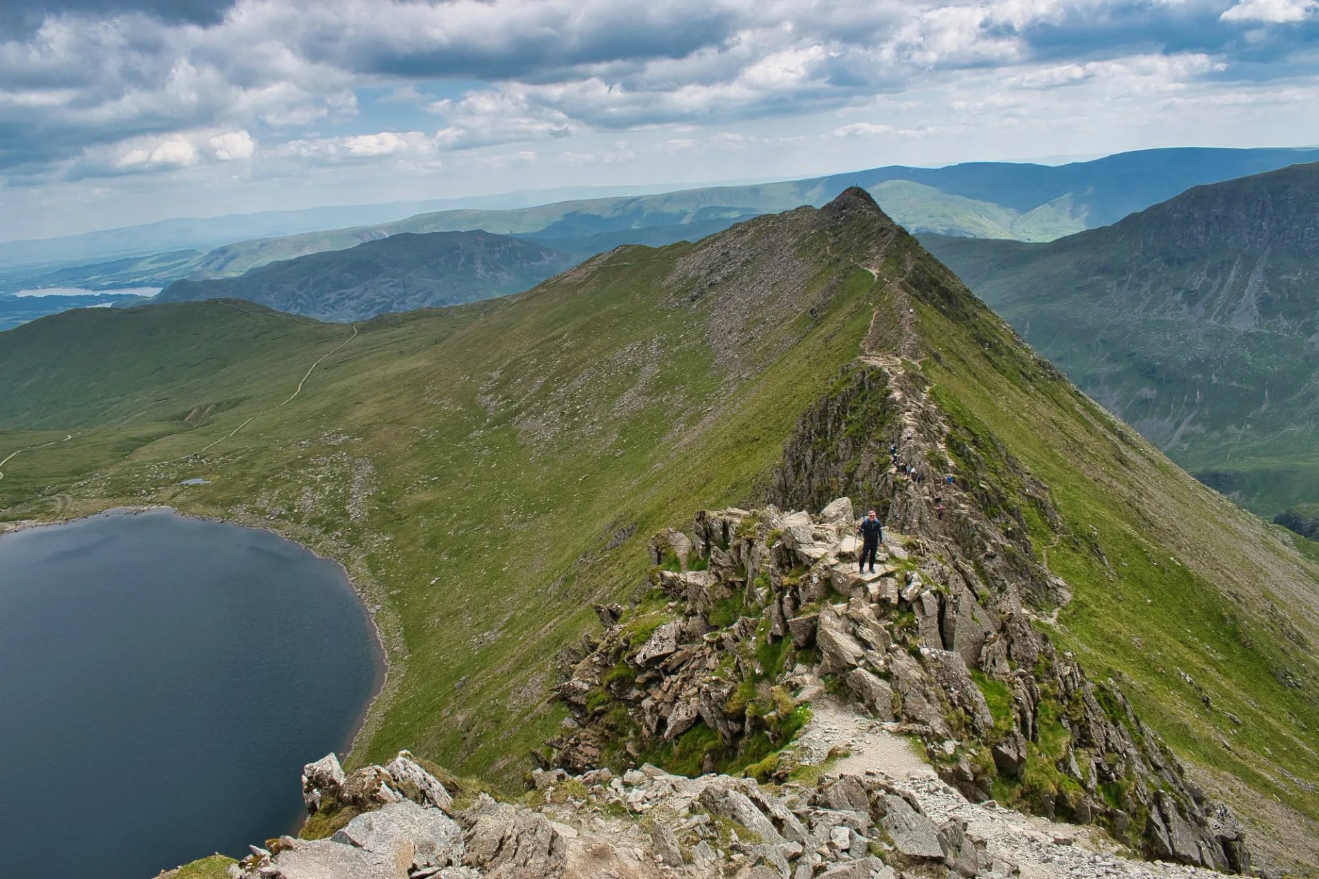 The narrow rocky crest of Striding Edge running up to Helvellyn above Red Tarn