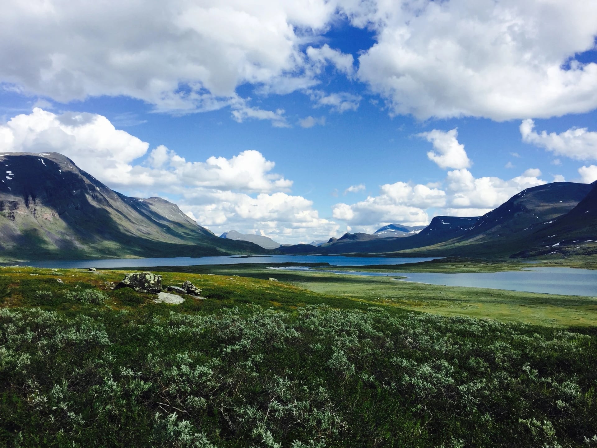 Beautiful lake surrounded by mountains near Alesjaurestugorna along Kungsleden hiking trail in Northern Sweden