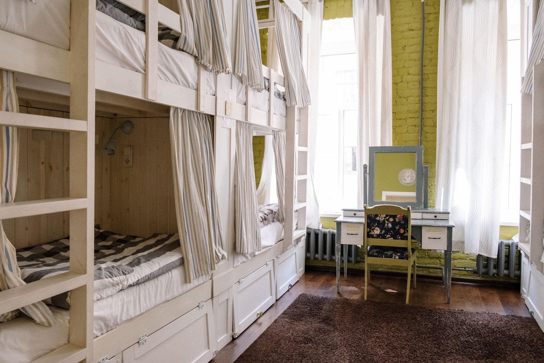 Made up bunks in a shared mountain hut dormitory