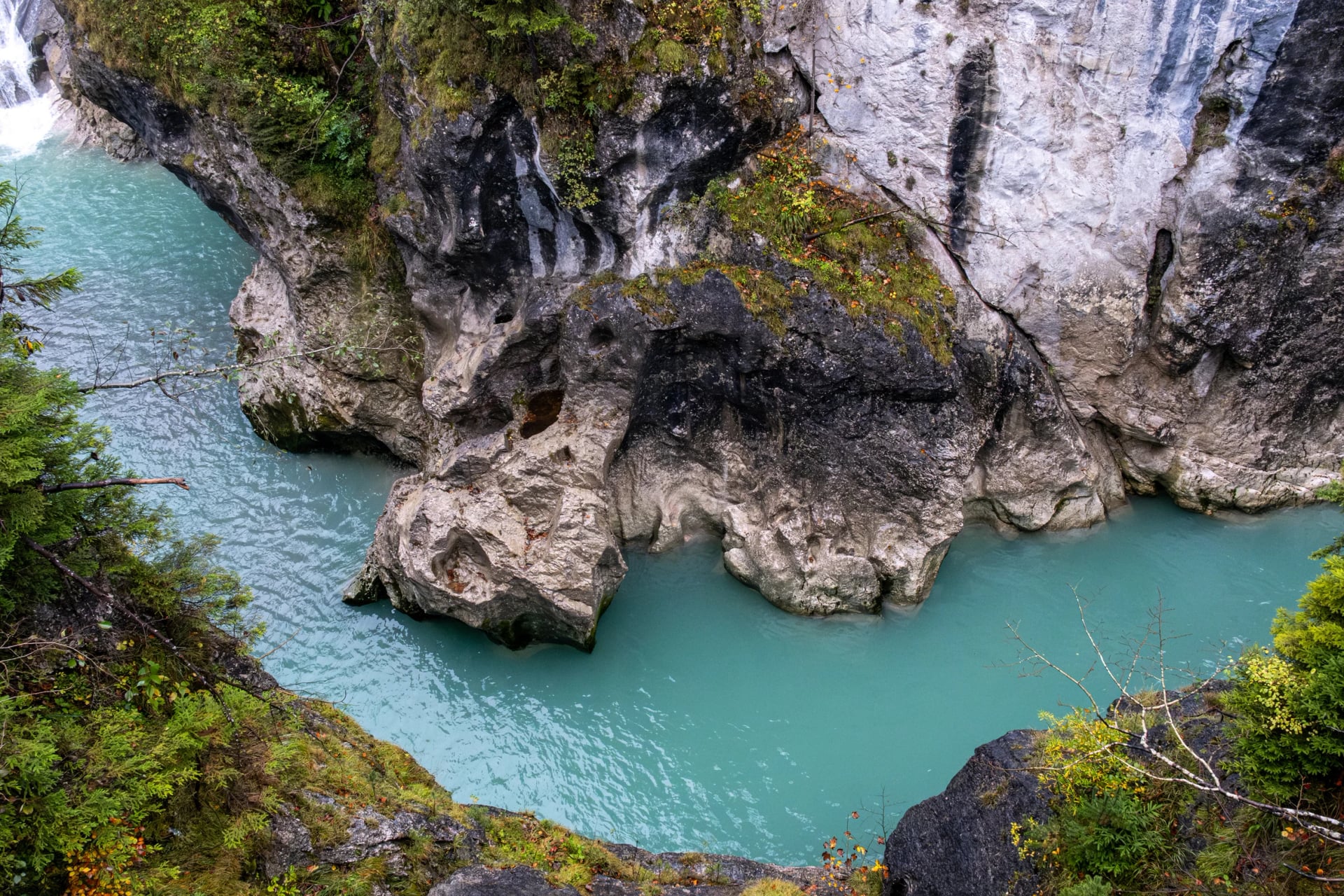 Turquoise river Lech flowing through rocky gorge near Füssen, Bavaria, Germany.