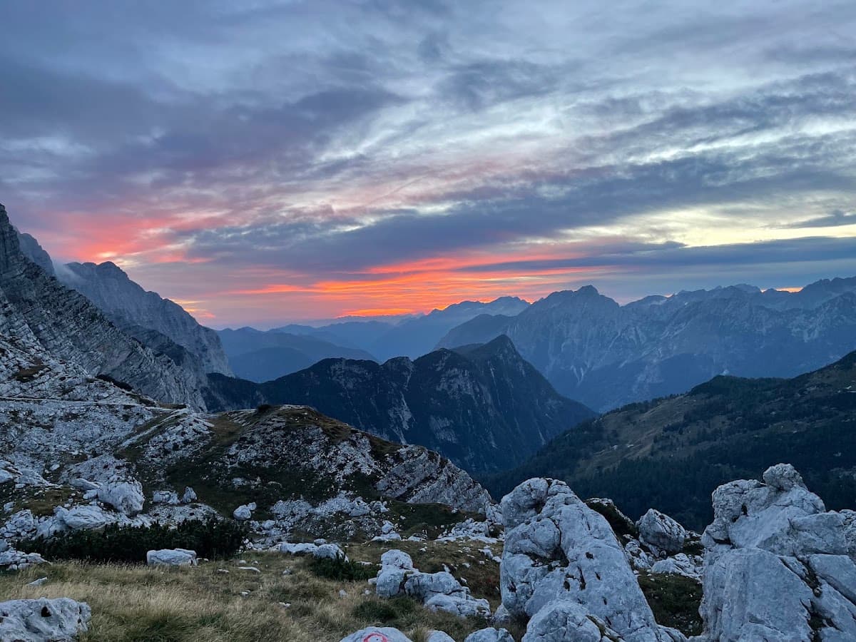 Alpine mountain peaks at sunset with dramatic cloudy sky