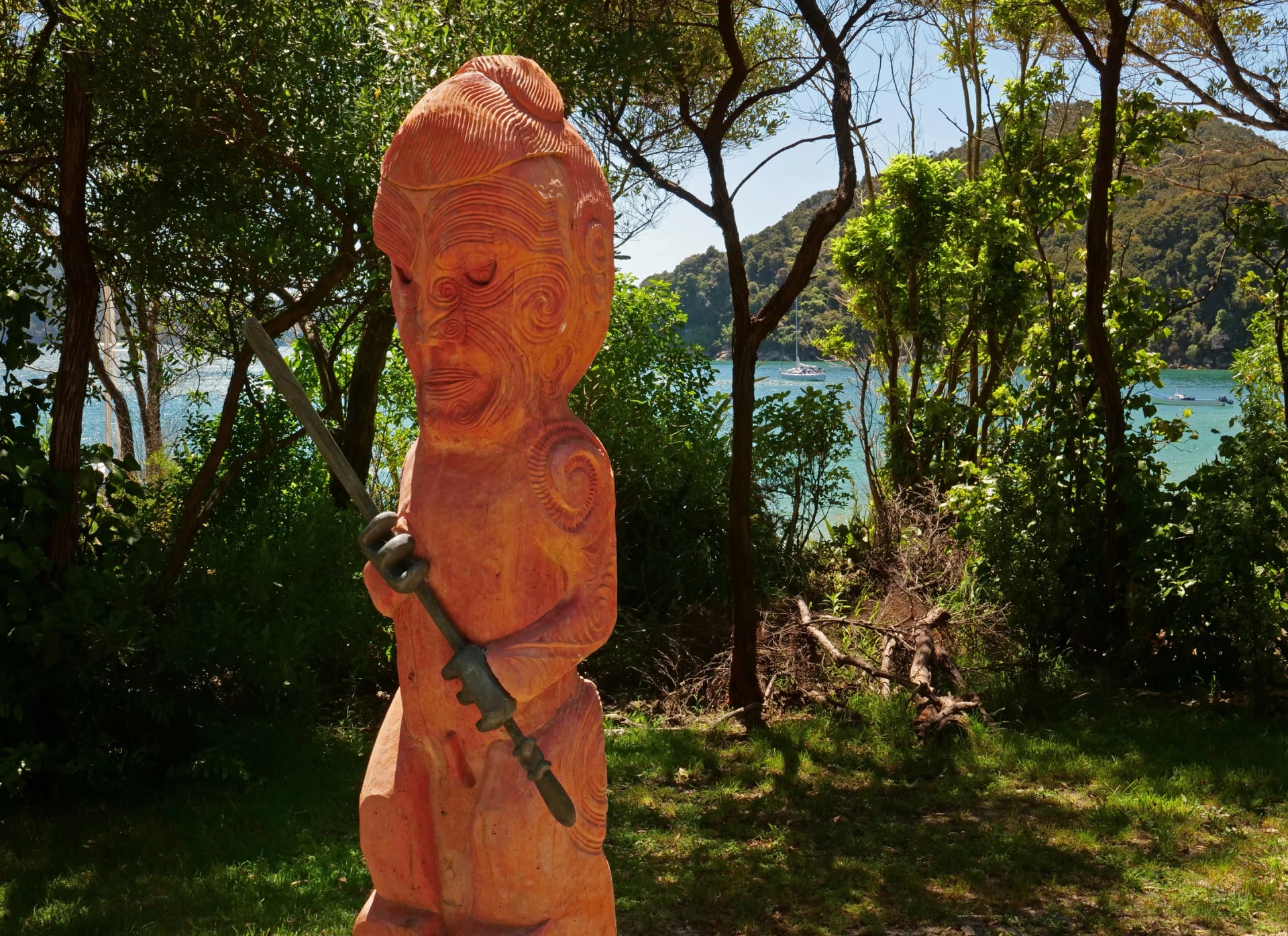 Maori statue. Woodcarving. Abel Tasman Park South Island New Zealand. Kaiterteri coast
